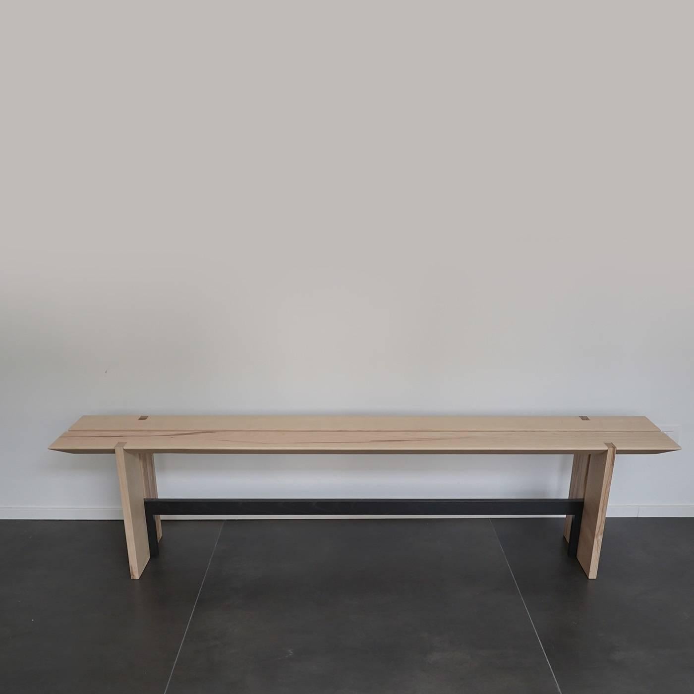 A modern, minimalist piece made of natural hardwood and iron whose design accentuates the beauty of simple shapes and mixes two materials. This stunning piece features two planks supported by a base in iron with black matte finish whose legs are