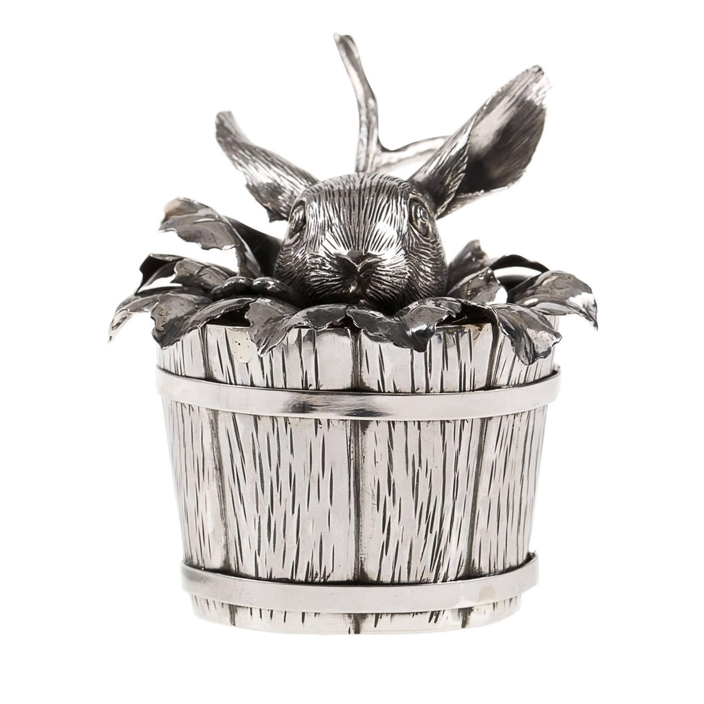 Sterling silver sugar bowl in the form of a small bucket, from which a curious bunny playfully peeks out. Entirely handcrafted by the artisan silversmith atelier Fratelli Lisi in Florence, the piece is embossed and engraved by hand.
 