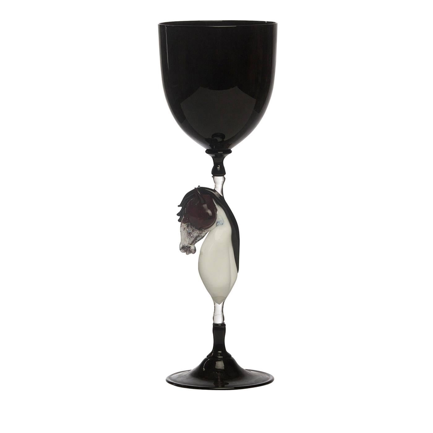 A set of six exquisite wine glasses handcrafted in Murano by the famous Venetian glass master Dario Frare. Executed using the traditional blowing technique, this set in signature glossy black glass is achieved thanks to its working with manganese.