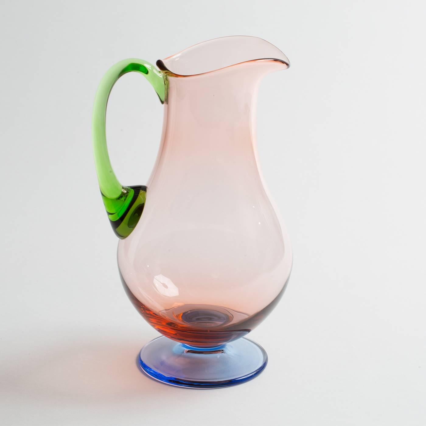 This exquisite set is comprised of six liquor glasses, six wine glasses and six flutes. Each glass is enhanced by vivid colors: pink for the body, green on the stem, and pale blue on the base. The pitcher has a body in pink, the base in pale blue