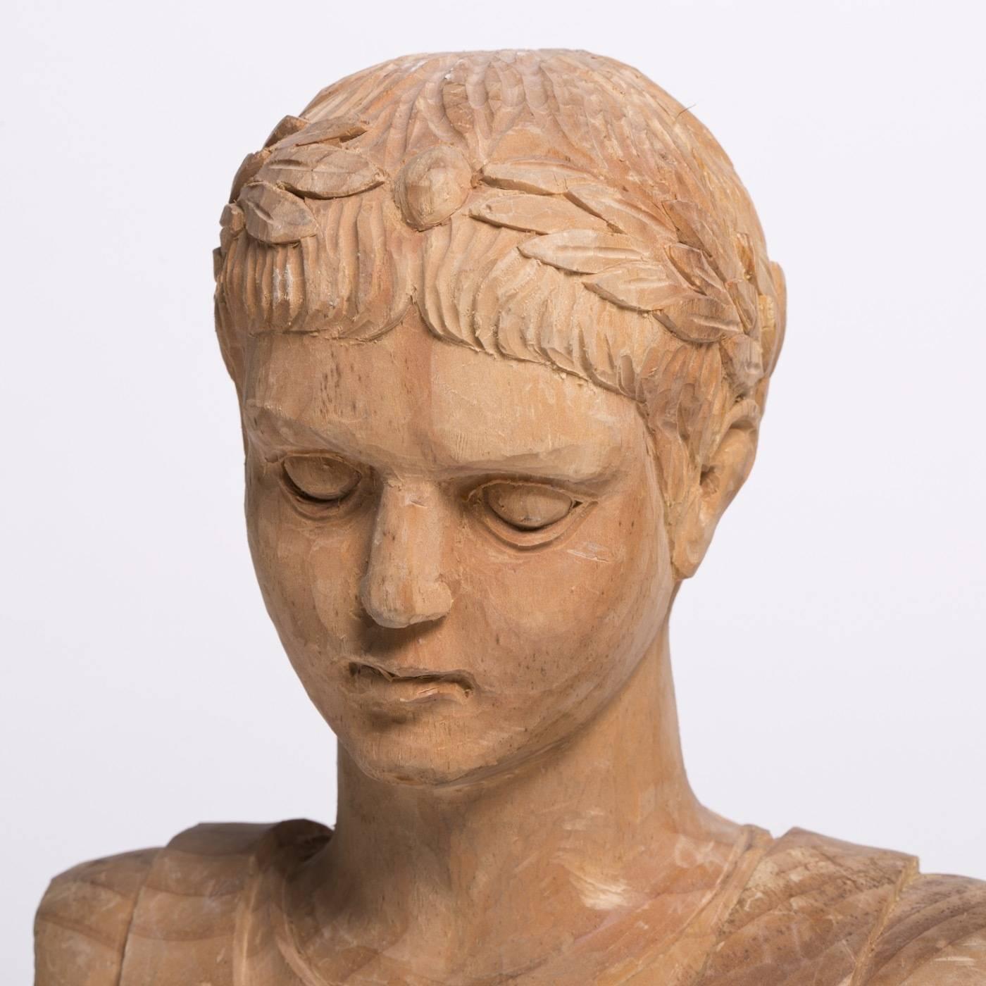This classical bust of a young Caesar is masterfully hand-carved by Bartolozzi e Maioli in elegant Austrian pine with a natural finish. The piece was originally designed in the 1980s for a New York Architecture studio.