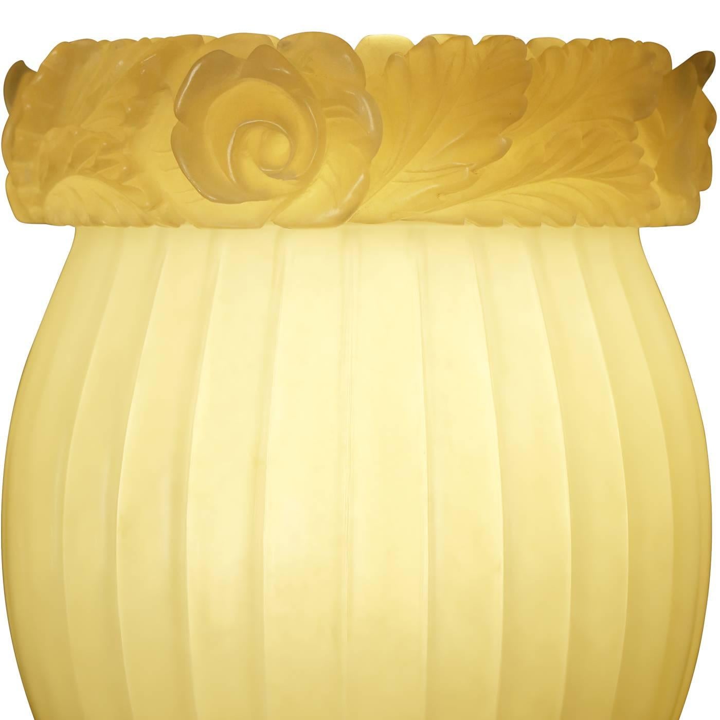 One-off lampshade in alabaster by artist Gloria Giannelli. A flower motif has been crafted to the borderline giving the otherwise minimalist shade a touch of Giannelli's feminine signature style. The color is a soft amber.