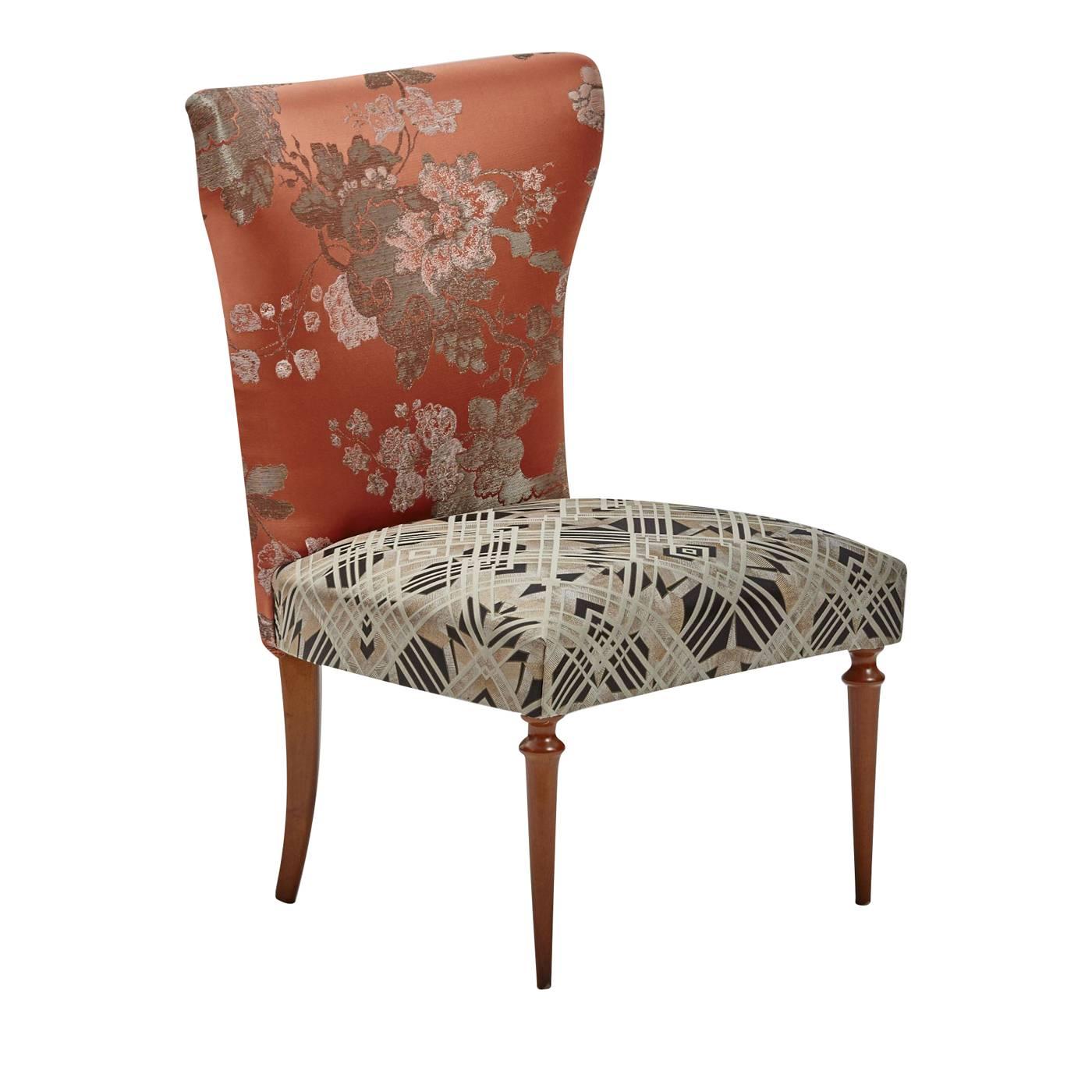 The Silhouette of this sophisticated chair is inspired by the elegant design of a vintage chair from the 1940s that Laura and Nino found. On the poplar and beech wood structure that they recreated, the backrest cushion is upholstered with a precious