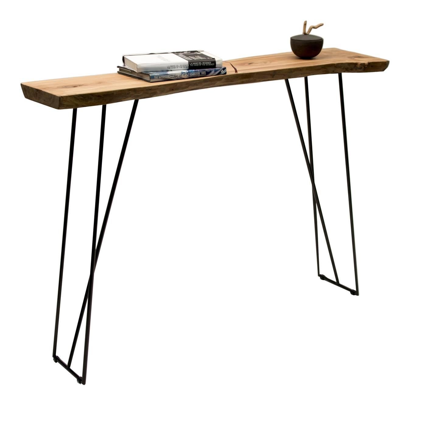 This elegant yet rustic side console features a slim metal supporting structure with black powder coating. The top is made of solid, aged olivewood, with a wax polish and natural, raw edges. This piece is one-of-a-kind.
