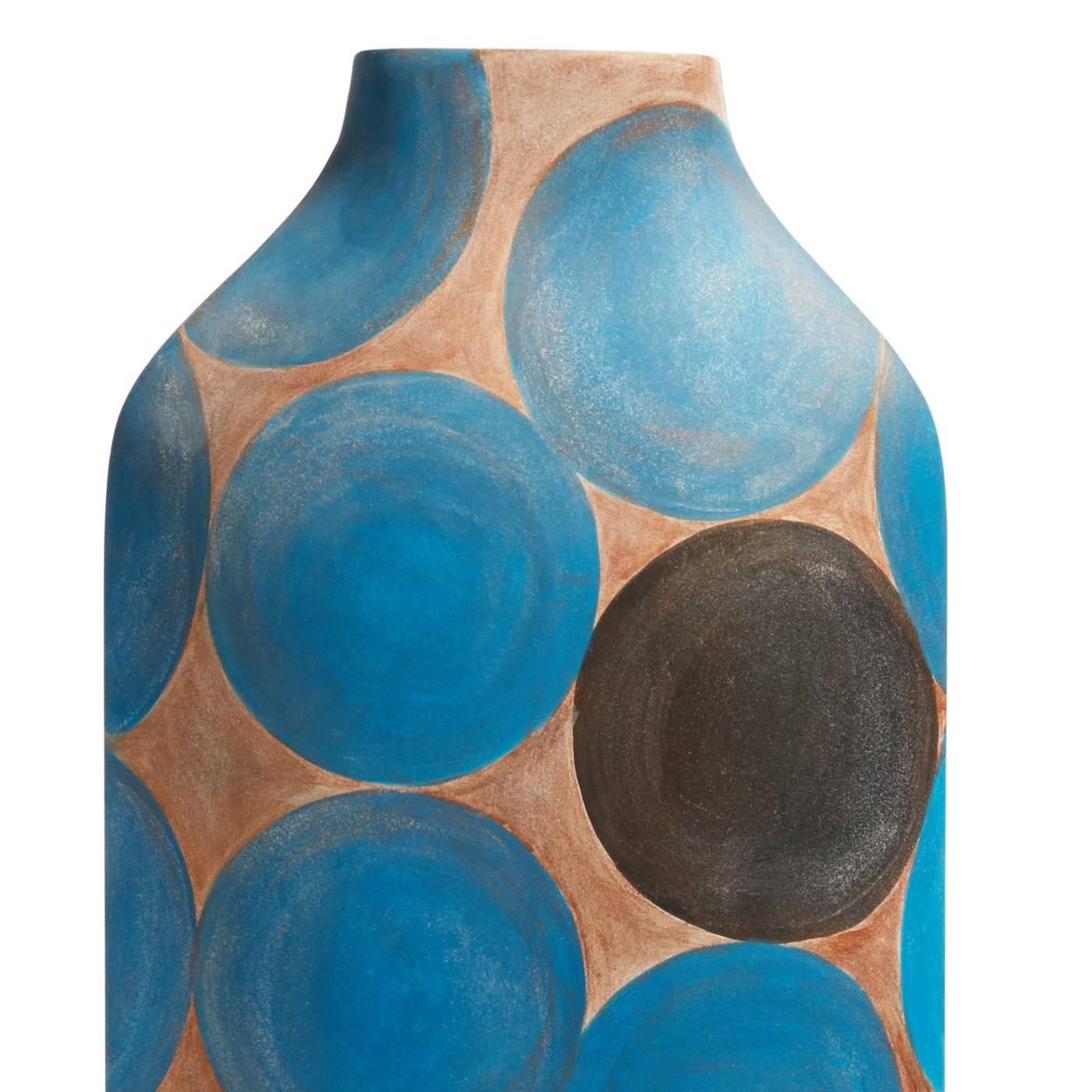 This striking vase was entirely decorated by hand and is part of a limited edition of 50 pieces designed by Rosaria Rattin. The simple, elongated lines of this vase are decorated with the use of blue and black large dots over a light brown