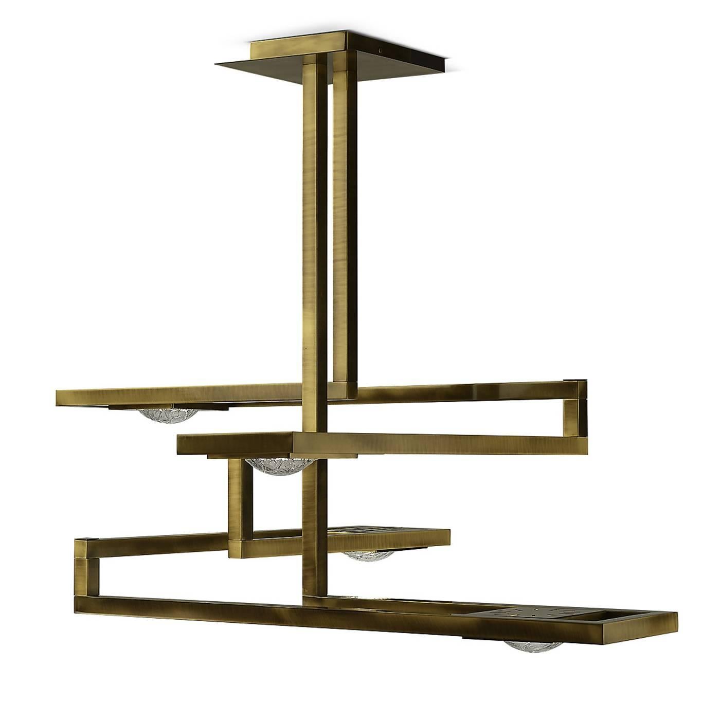 This stunning ceiling lamp is made entirely of brass with a square base attached to the ceiling from which two vertical elements stem, creating a series of legs positioned at different heights in the shape of a rectangle. At the edges of each arm, a