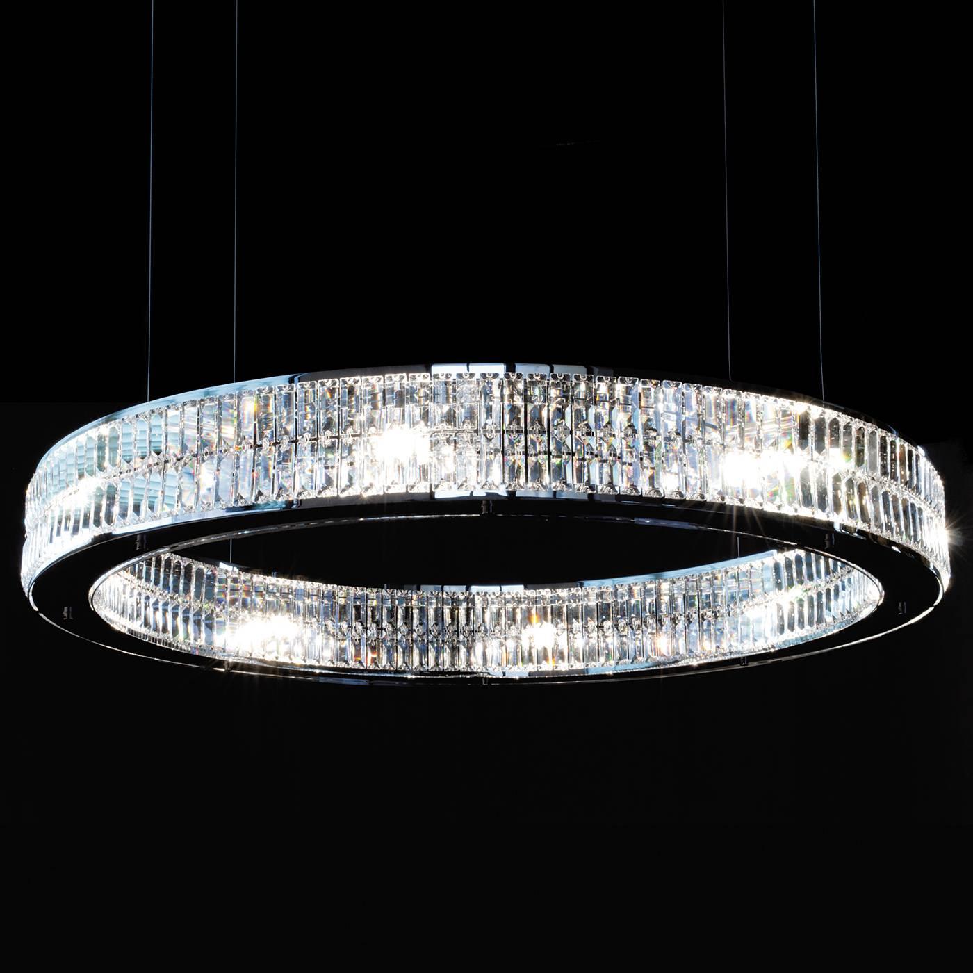 A lavish piece of functional decor, this chandelier will be a sumptuous and modern accent in a contemporary home as well as a classic interior. The ring that constitutes its shape is made up of two layers of handmade crystal prisms attached both