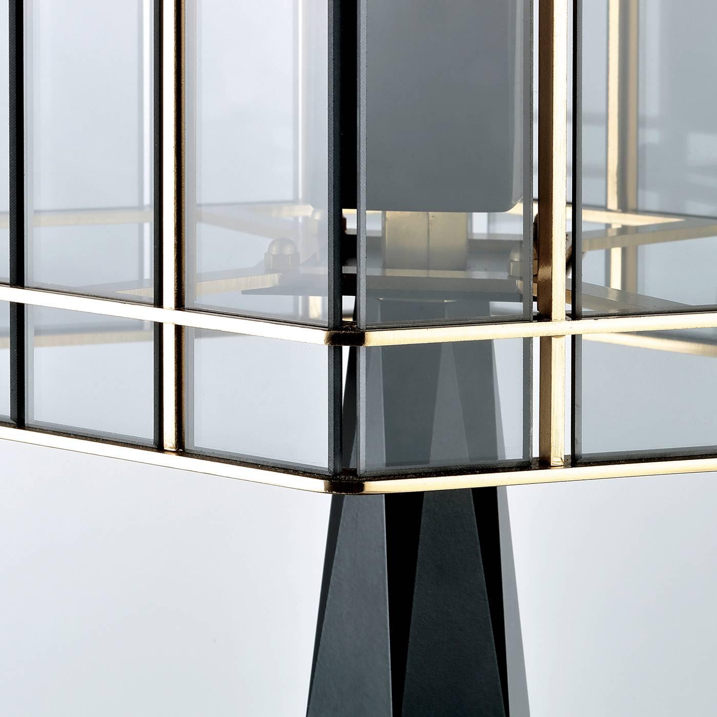 This elegant table lamp features a Classic design, reinterpreted with a contemporary sensibility that is inspired by the style of Art Deco home decor. The result is a timeless piece that will complement any interior and can be combined with other
