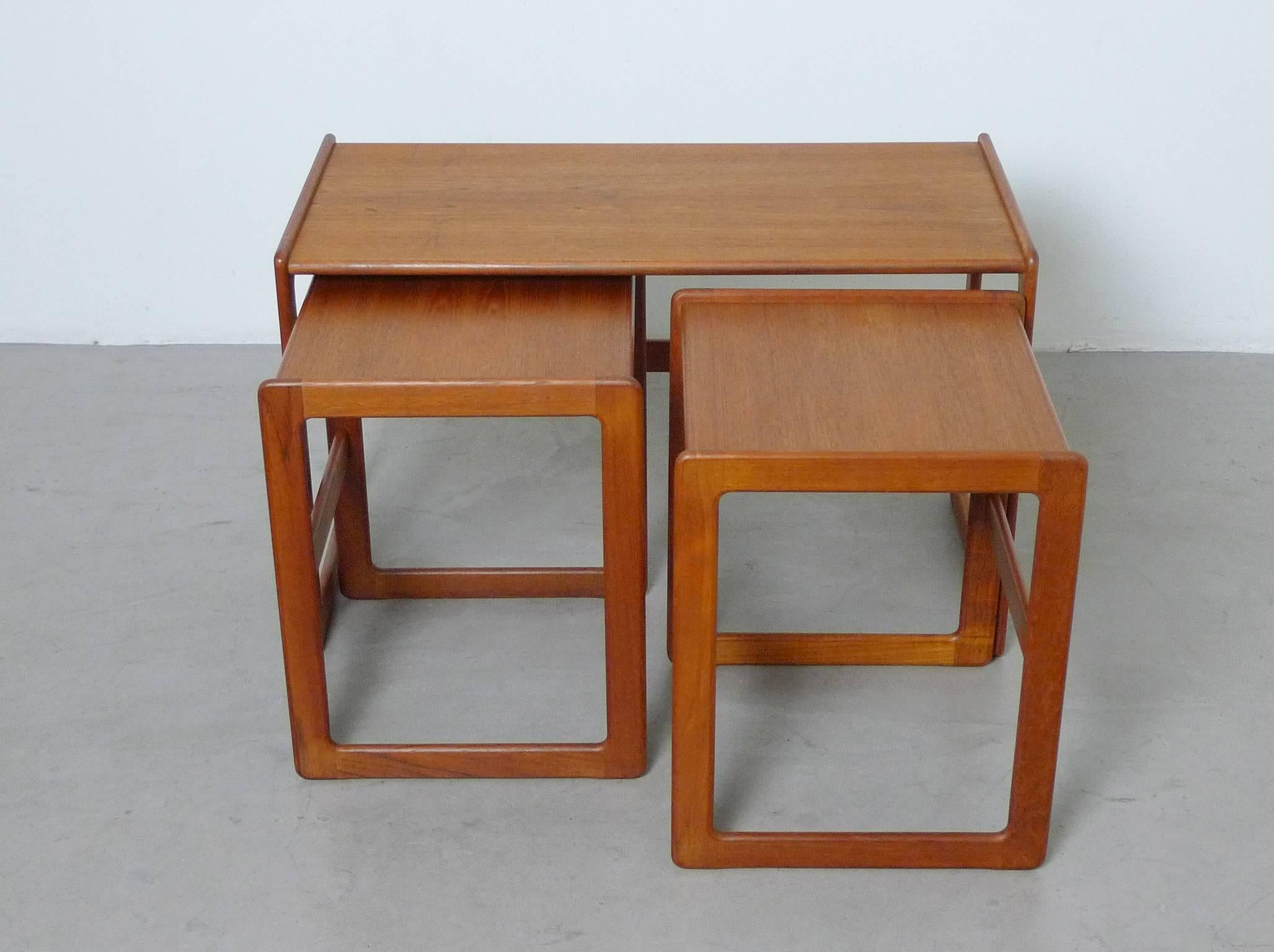 This nesting table set was designed by Arne Hovmand-Olsen for the Danish manufacturer Mogens Kold in 1962. The teakwood tables are in a very good condition.