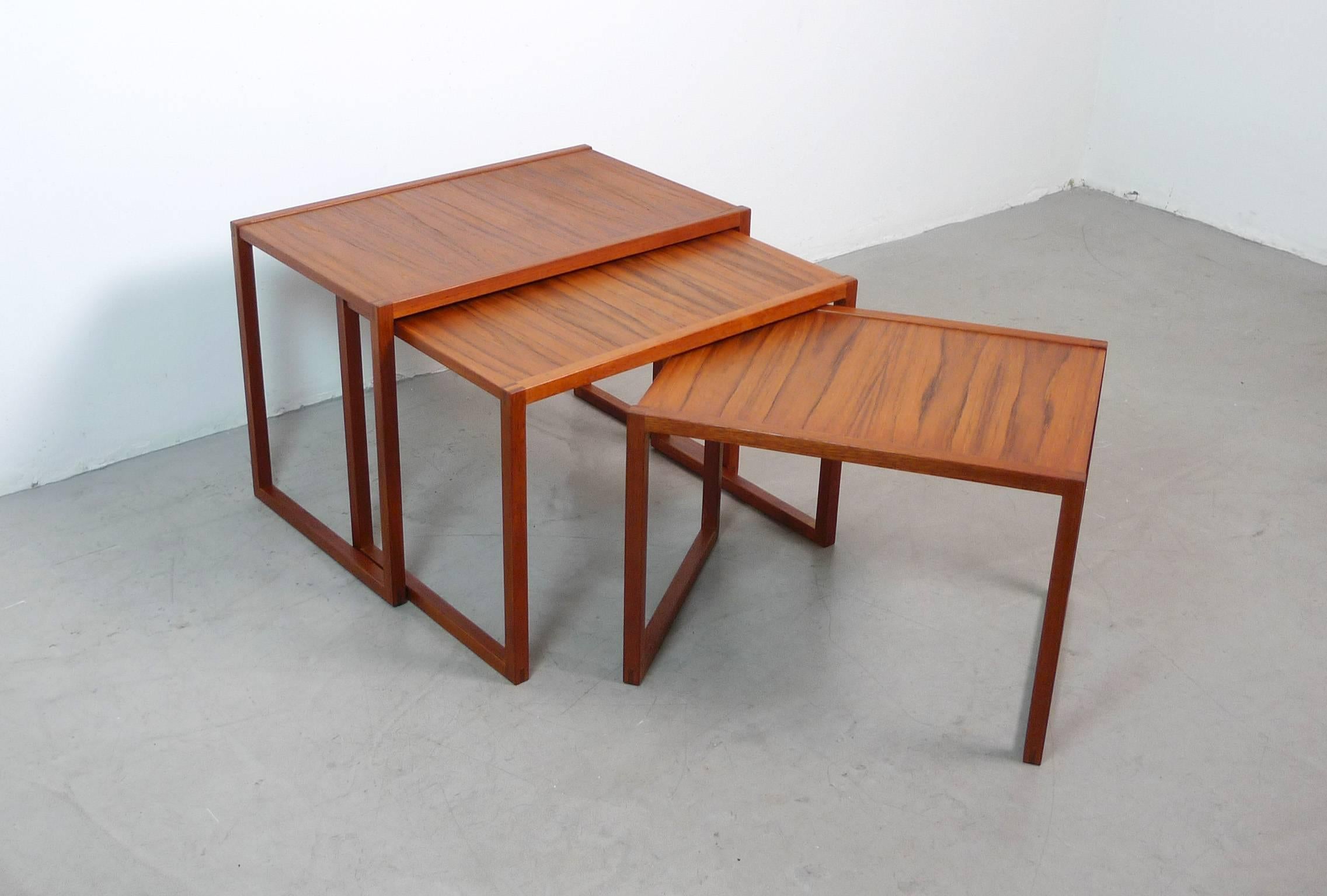 Danish nesting table set with cubic form made of teakwood from the 1960s.
The biggest table is 60 cm wide and 42 cm high.
The table in the middle is 55 cm wide and 40 cm high.
The smallest table is 50 cm wide and 37 cm high.
All tables are 38 cm