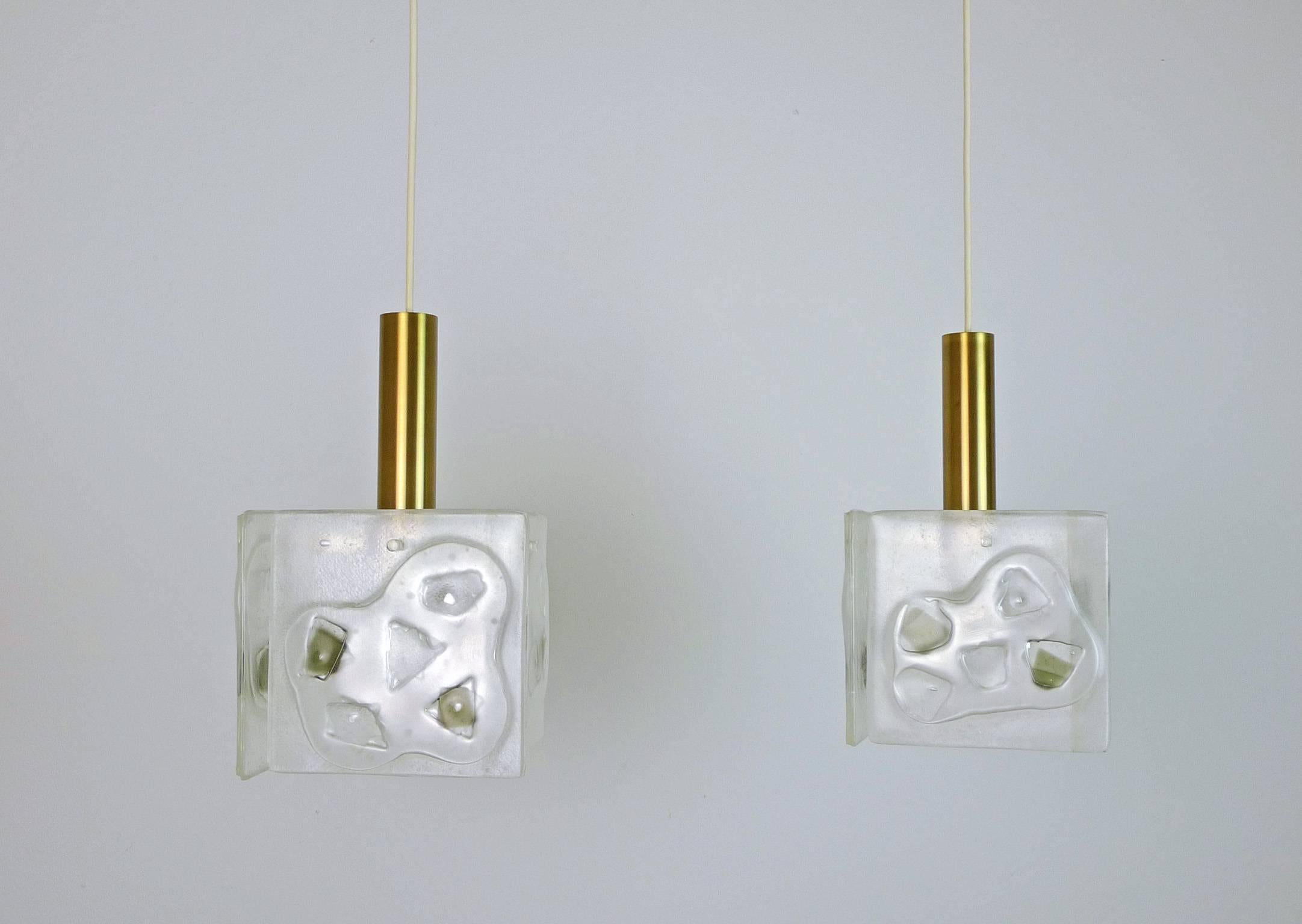 Two cubic ceiling lamps with structured and inlaid glass. Each lamp has four square glass plates, which are fixed by a decorative screw around a brass cylinder. These lamps were produced in the 1960s in Germany and they are in very good vintage