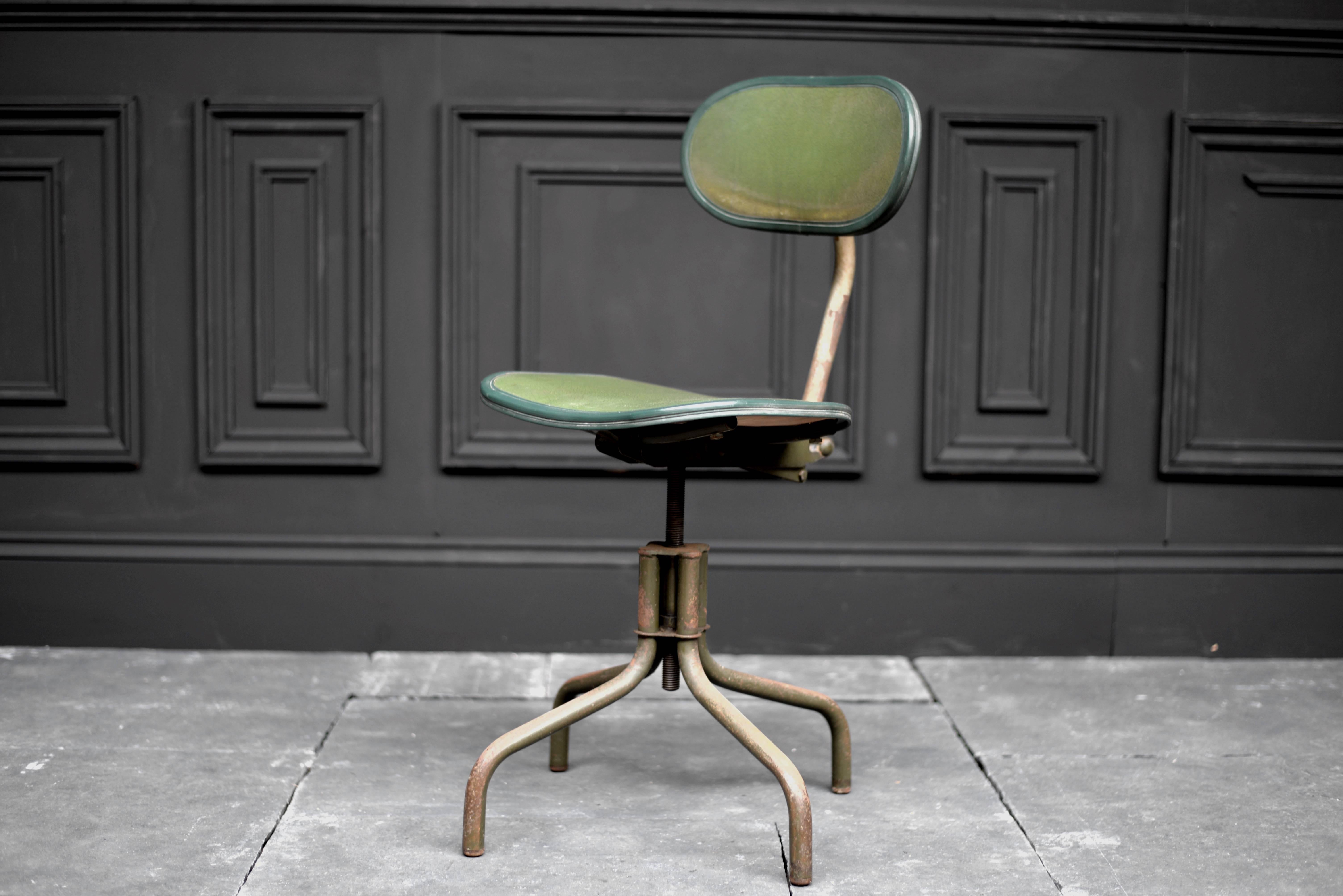 Early 20th century 'Metchair Production' green machinist chair with adjustable seat height from 16' to 23'.

Dimensions 
Max overall height 36'
Seat width 16'
Seat depth 14'.