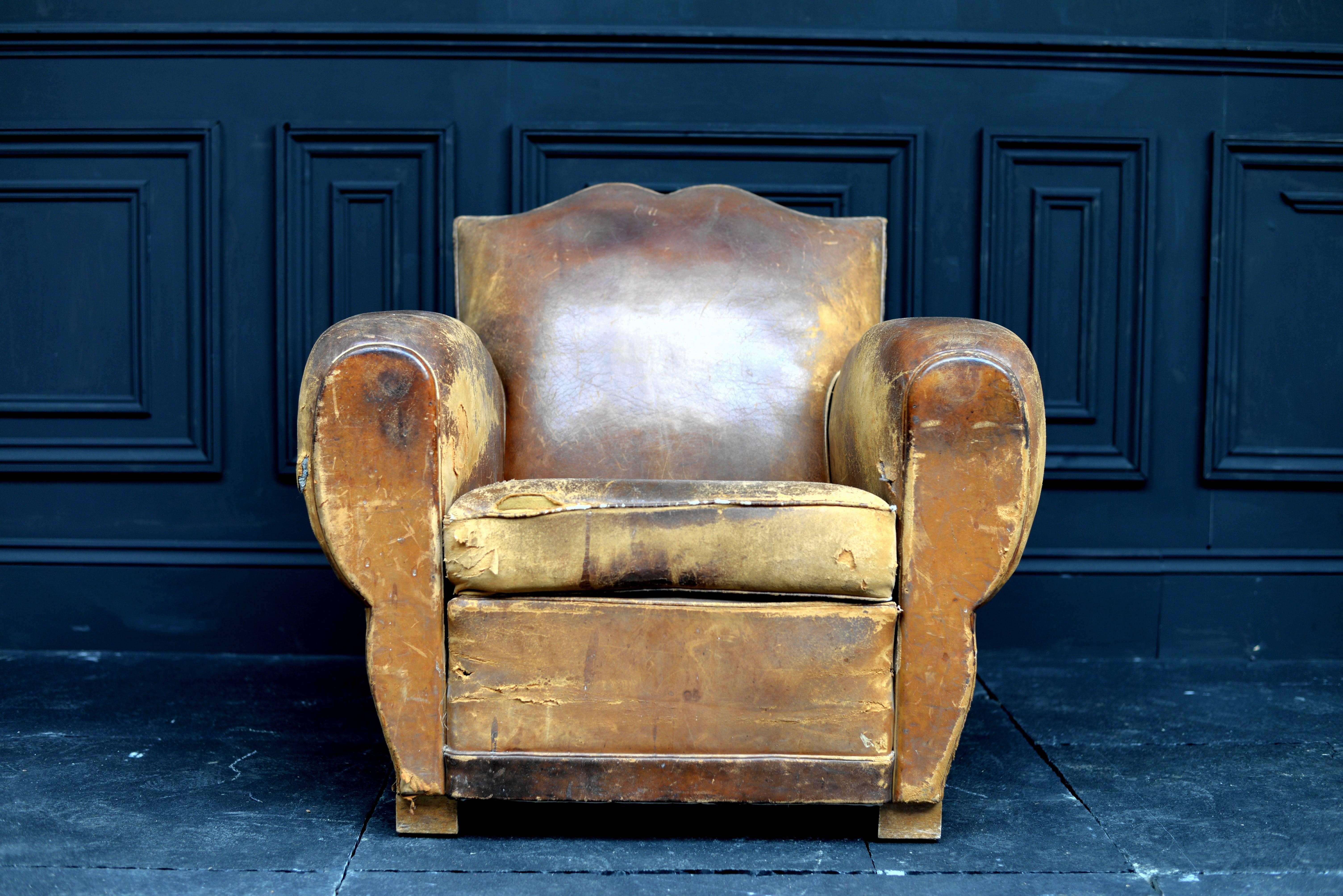 1920s French leather moustache chair.