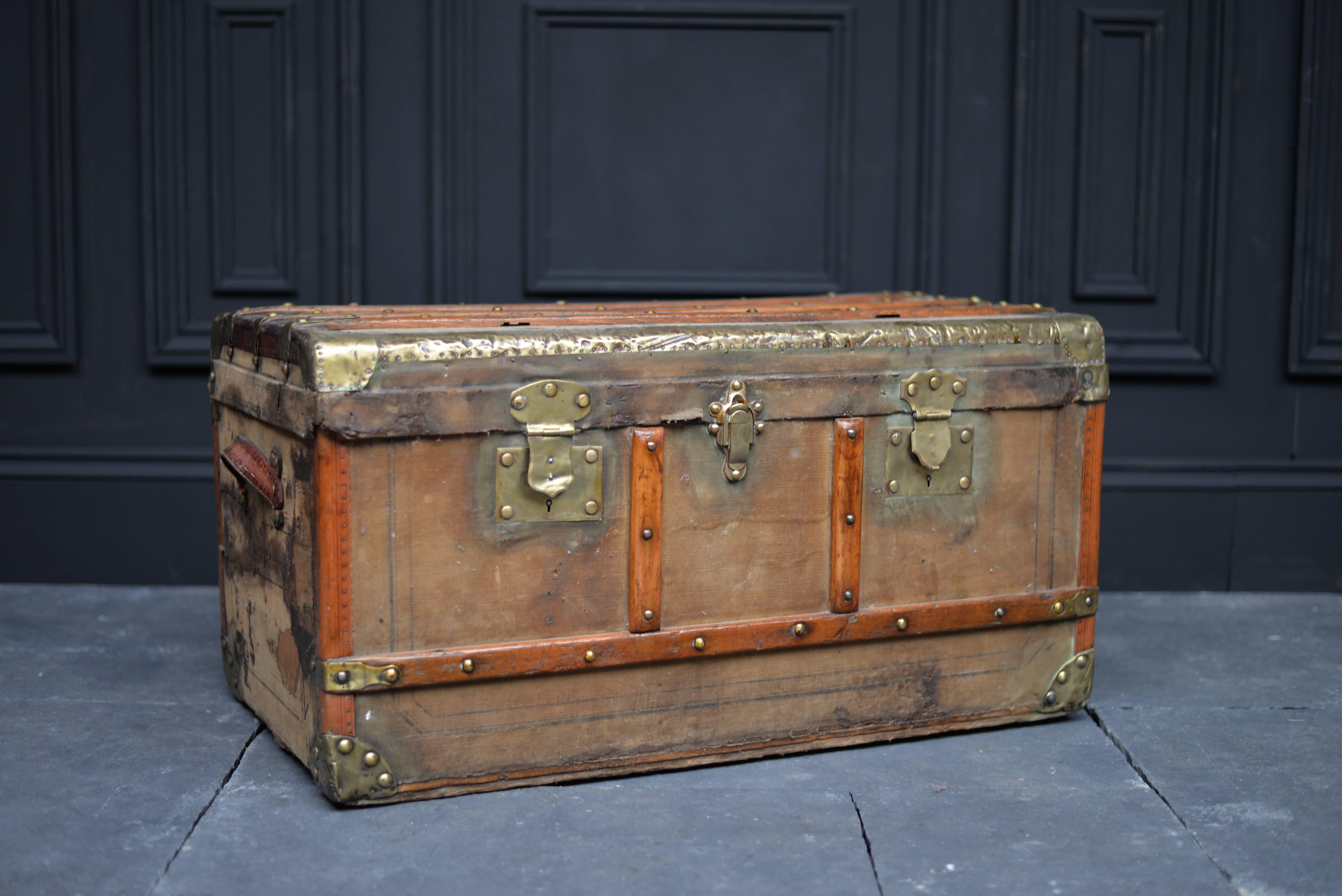If shipped to the US or EU, no import tax applies.  

This ornate trunk was made in France at the beginning of the 19th century. Decorated with rosewood rods, brass studs and railings, it features a triple locking mechanism and sturdy leather