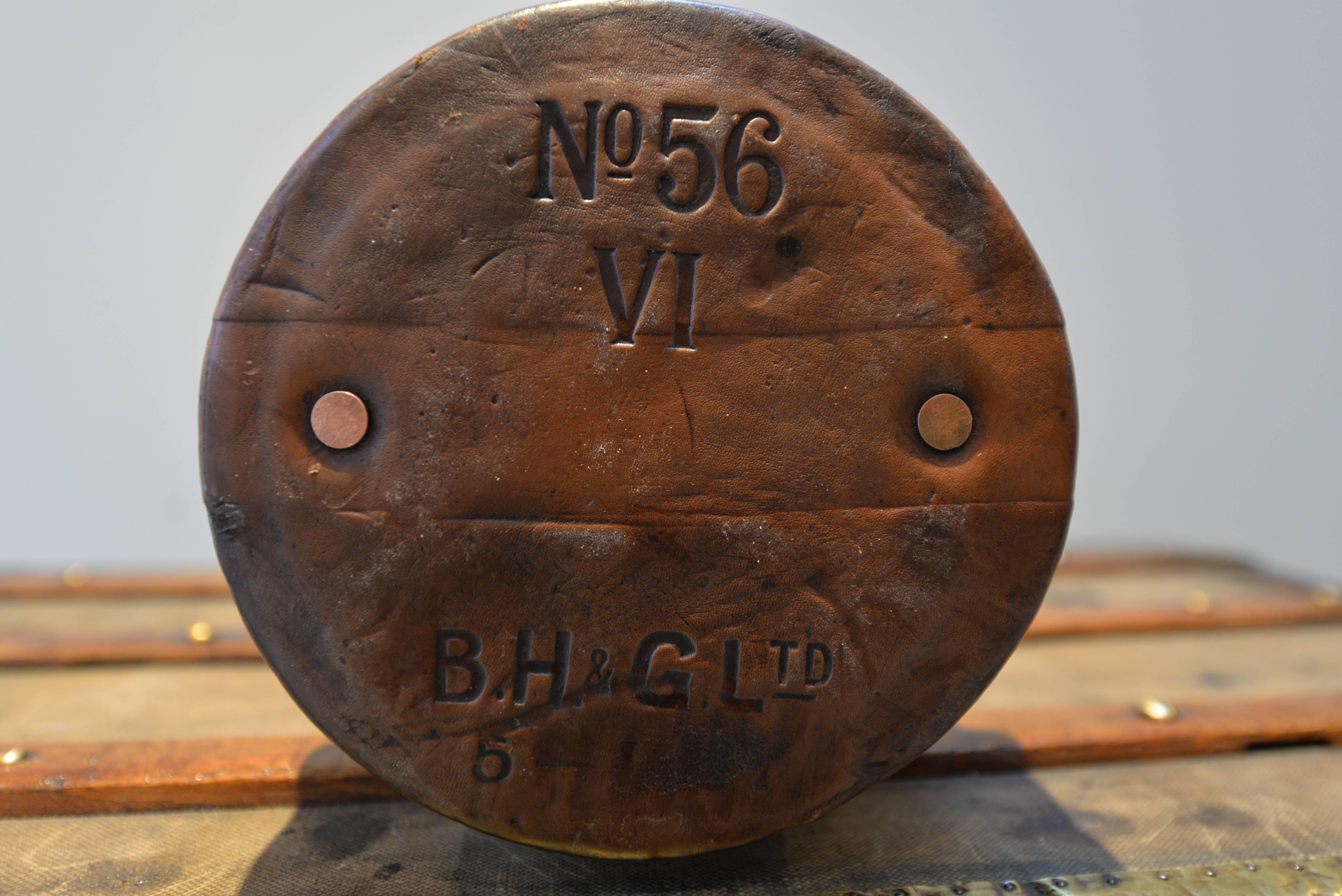 If shipped to the US or EU, no import tax applies.  

This turn of the century leather pouch is adorned with British Royal Coat of Arms with a King's Crown, stamped and numbered by the manufacturer and features internal canvas lining. 

This