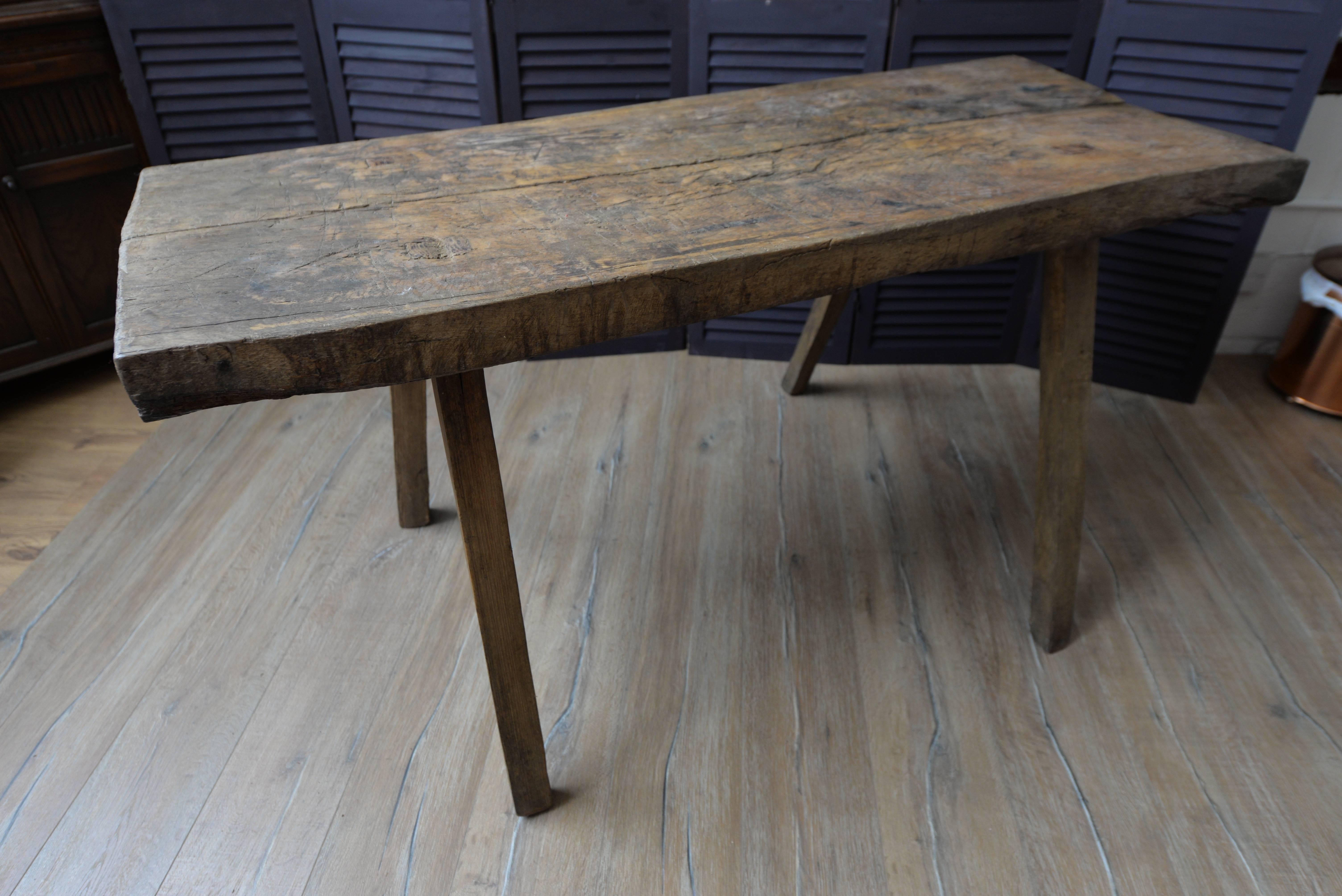 If shipped to the US or EU, no import tax applies.  

This table construction was used by butchers in France throughout the 19th century. Cuts and dents at the top of the wood have been originally marked by the working butcher and one can almost