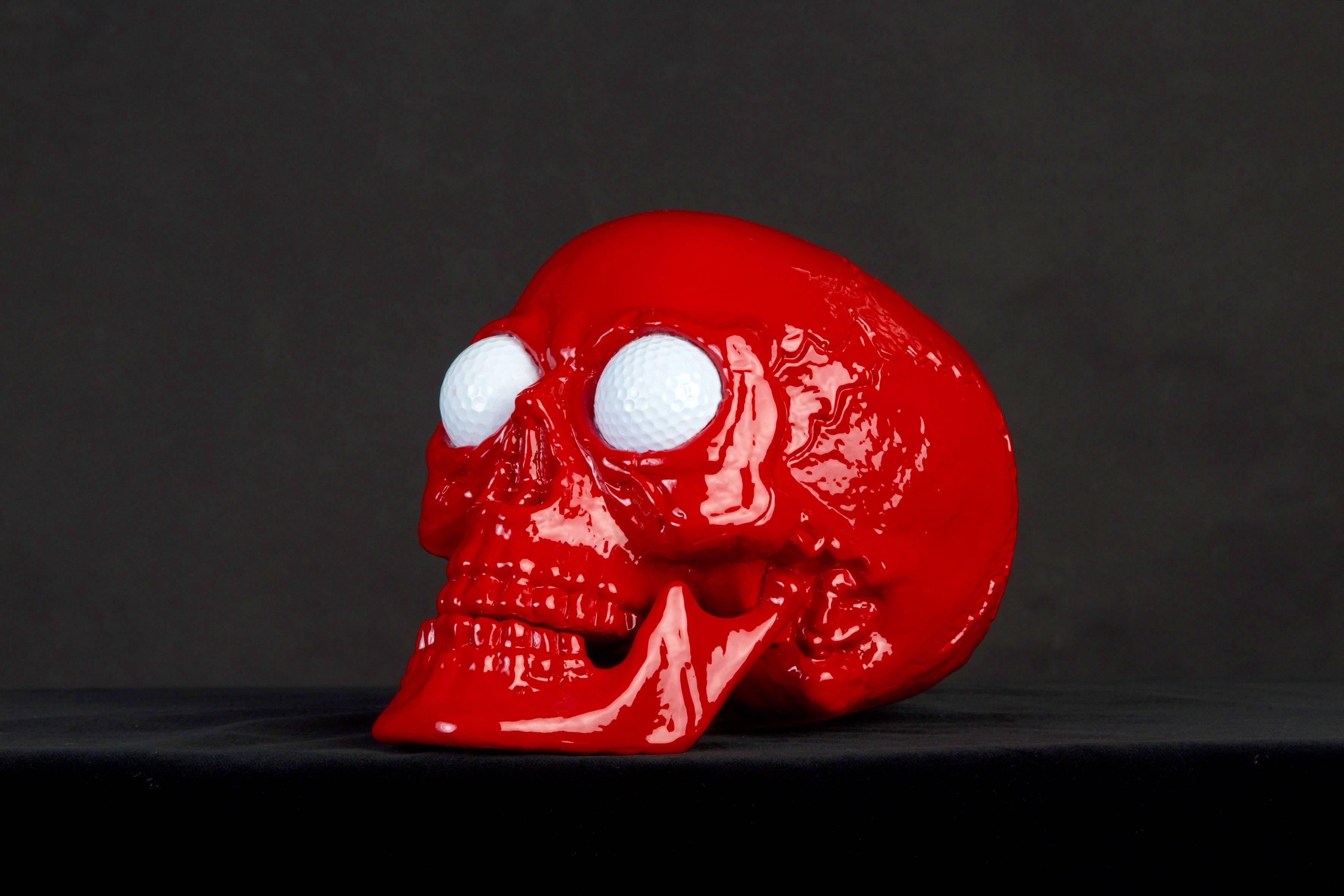 If shipped to the US or EU, no import tax applies.  

Made out of resin with actual golf balls inserted in the eye sockets, this skull sculpture is created by Hubert Prive, a French artists based in Normandie and a Pioneer of golf art now renowned