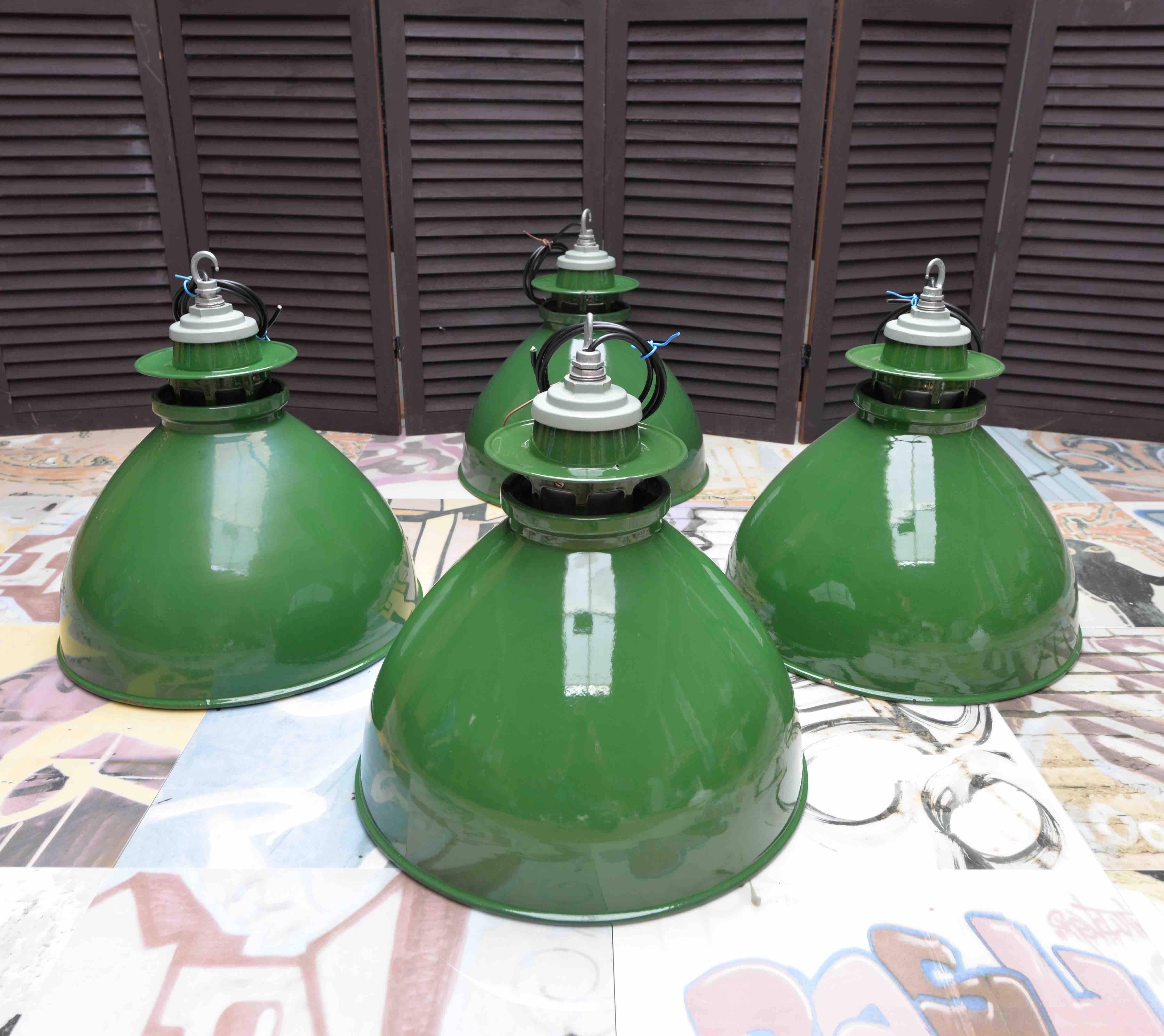 If shipped to the US or EU, no import tax applies. 

1 light available. 

These green pendants have been cleaned, polished and rewired.

The bulb fittings are original ceramic and the top fittings are detachable from the shades.

The