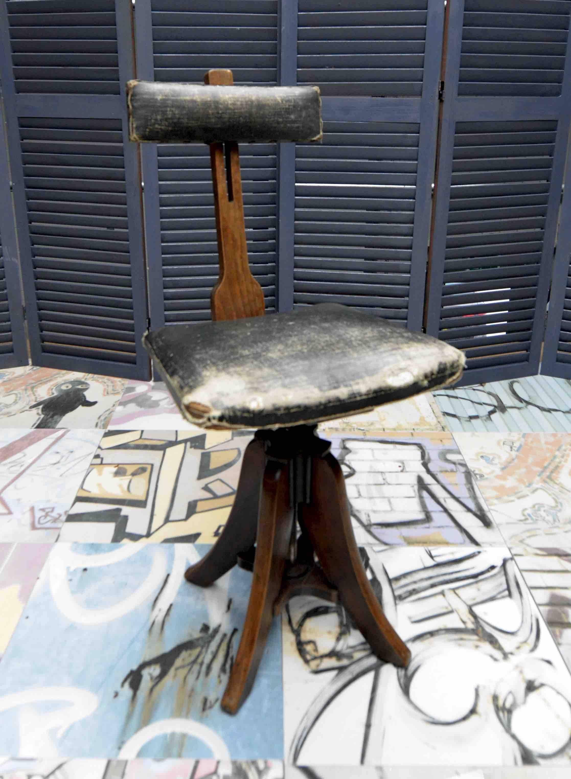 If shipped to the US or EU, no import tax applies. 

This is an English artist's/ draughtsman’s chair from the late 19th century with adjustable backrest and swivel seat. Stamped with 'Glenister High Wycombe' numbered 43, this chair features its