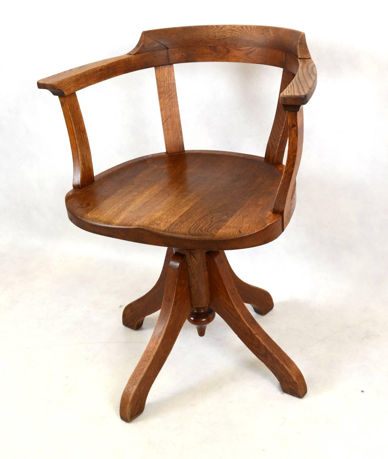 Swivel chair made in oak from Swedish post office.
