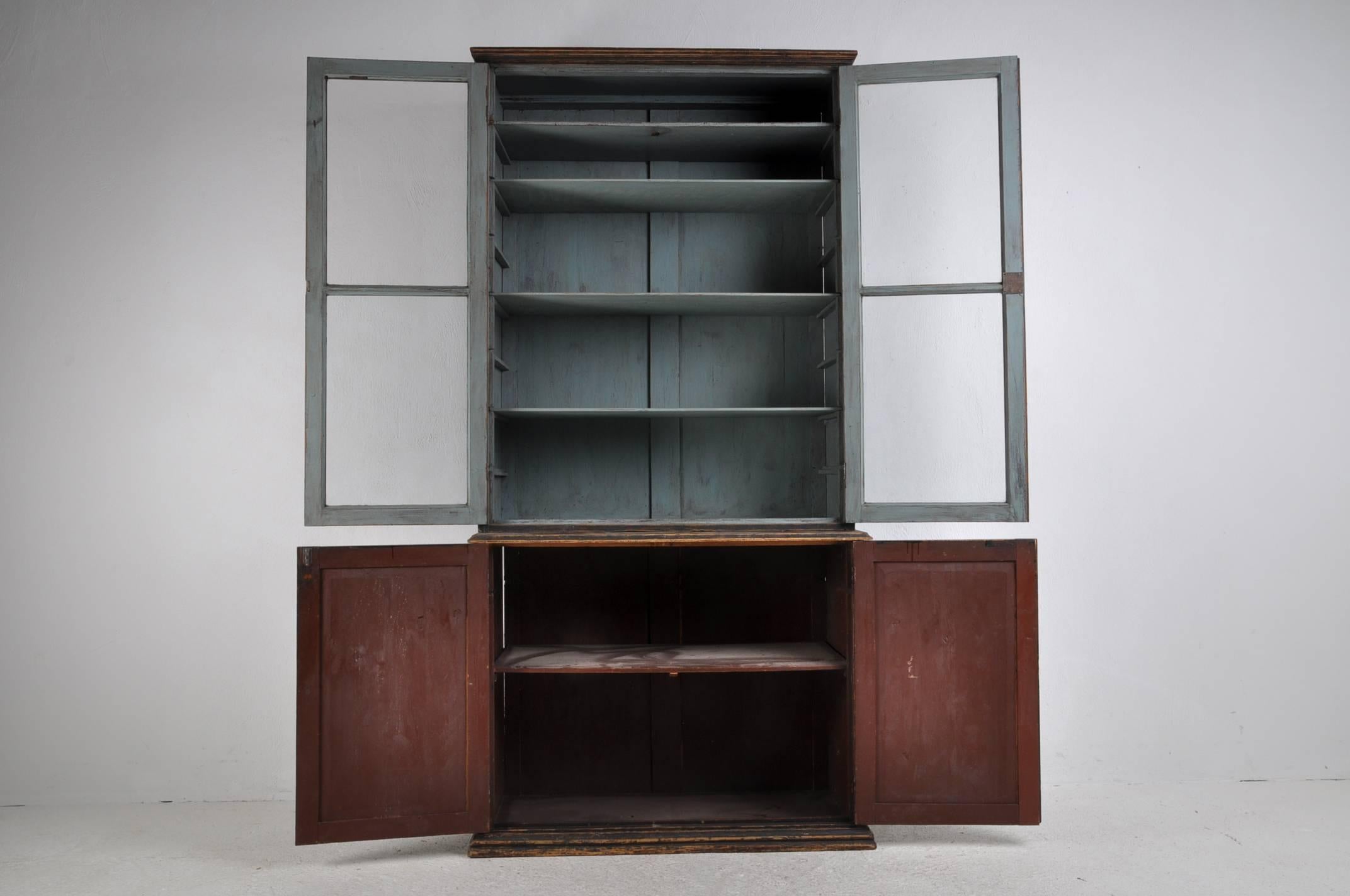 19th century black painted bookcase with original glasses and locks. Adjustable shelves.