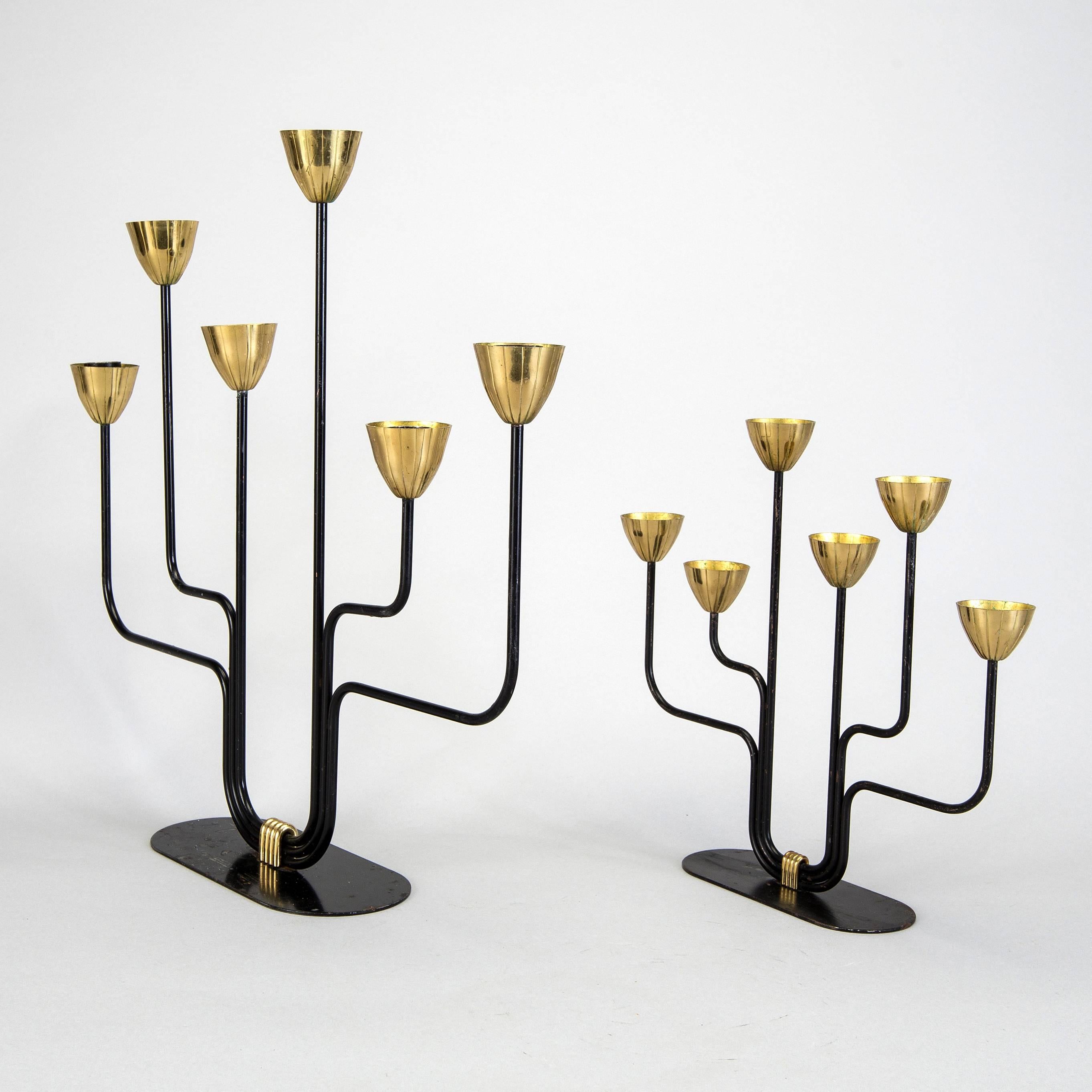 Pair of candelabras designed for Gunnar Ander for Ystad Metall in Sweden. They are made of black lacquered metal and have six brass candleholders each one.
They have two sizes:
Small: 11.5 inches height.
Big: 16.2 inches height.