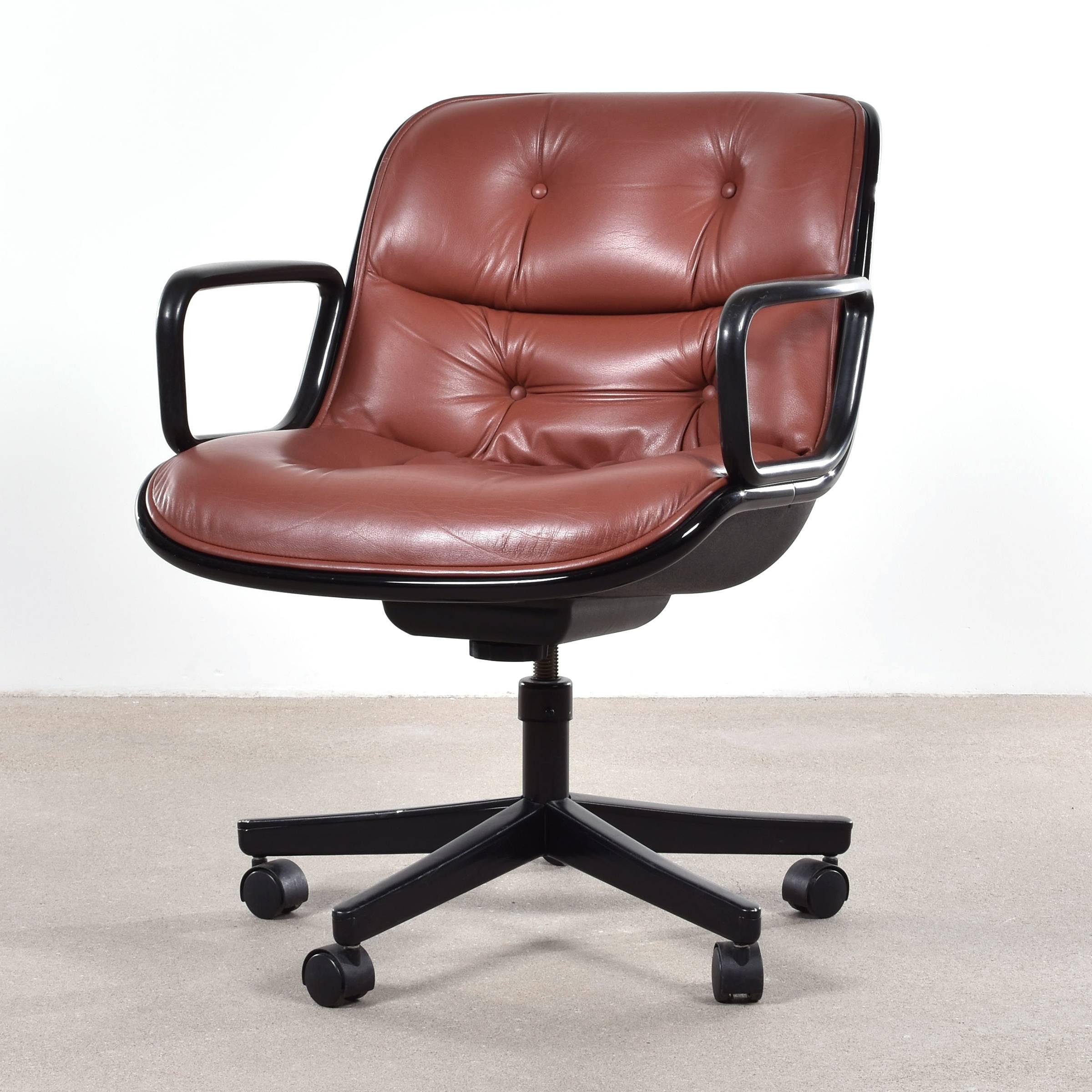 Iconic Pollock executive swivel armchairs on casters. Tilt-swivel mechanism and spindle seat-height adjustment. Original leather in very good condition. The chairs are signed with manufacturer's label.

Free shipping for European