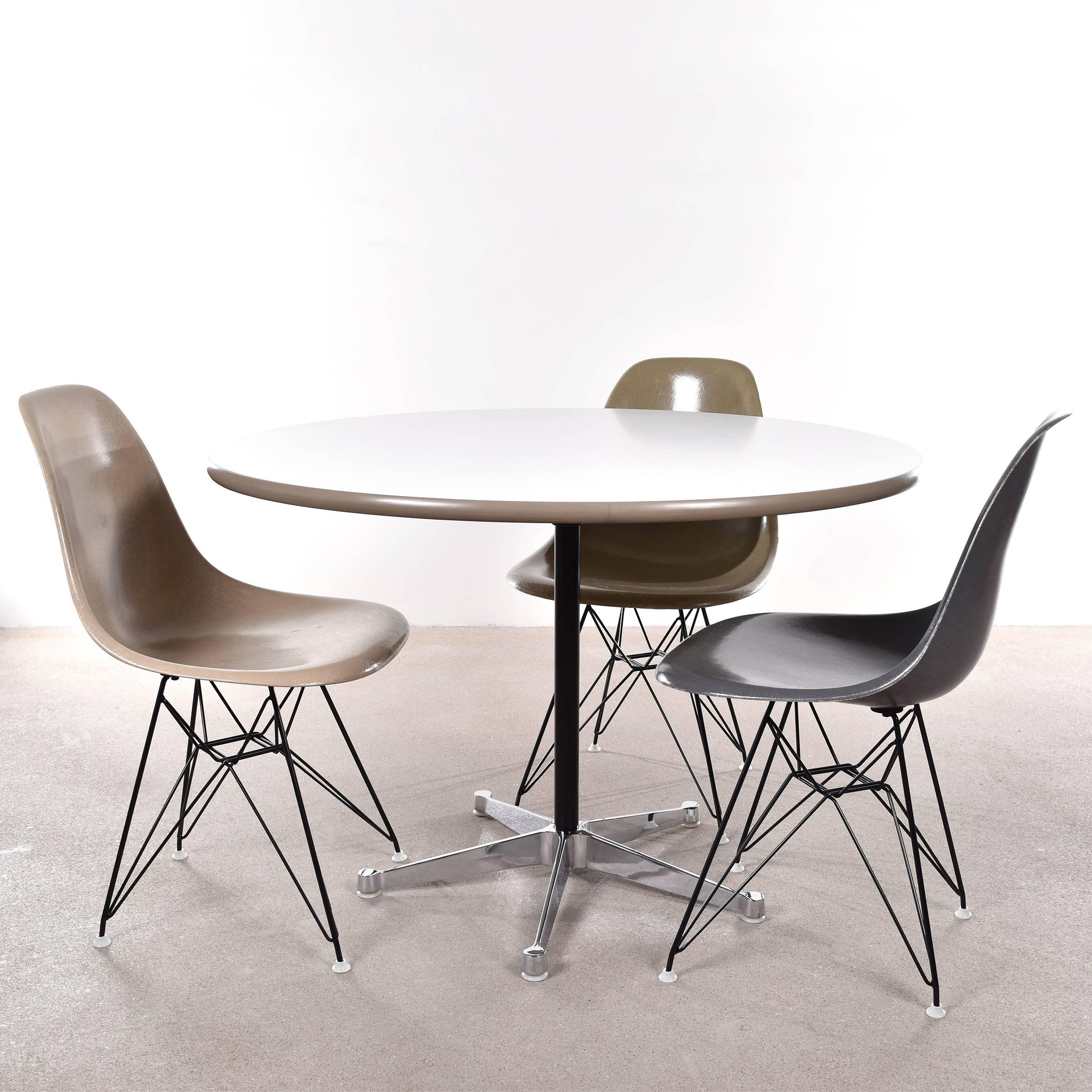 Beautiful small dining table by George Nelson for Herman Miller International Collection (Fehlbaum / Vitra). Table has a 5-star chromed contract base (which can also be found on Eames designs) and formica table top framed with rubber edge. Table top