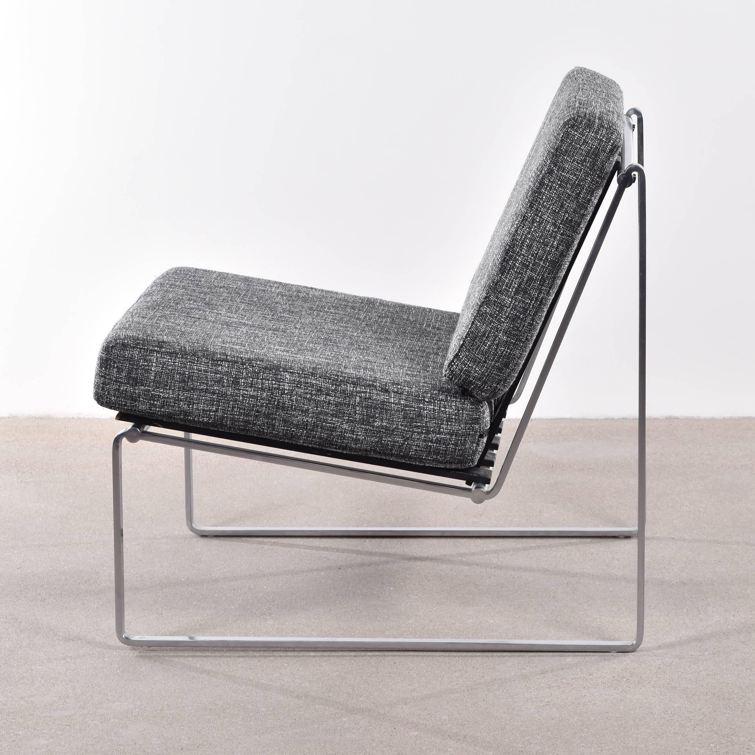Comfortable modernist lounge chair designed by Kho Liang Ie for Artifort, Netherlands. Solid metal (matte chrome) frame with black lacquered wooden slats. Signed with metal tag Artifort.
Cushions can be newly upholstered if desired, contact us for