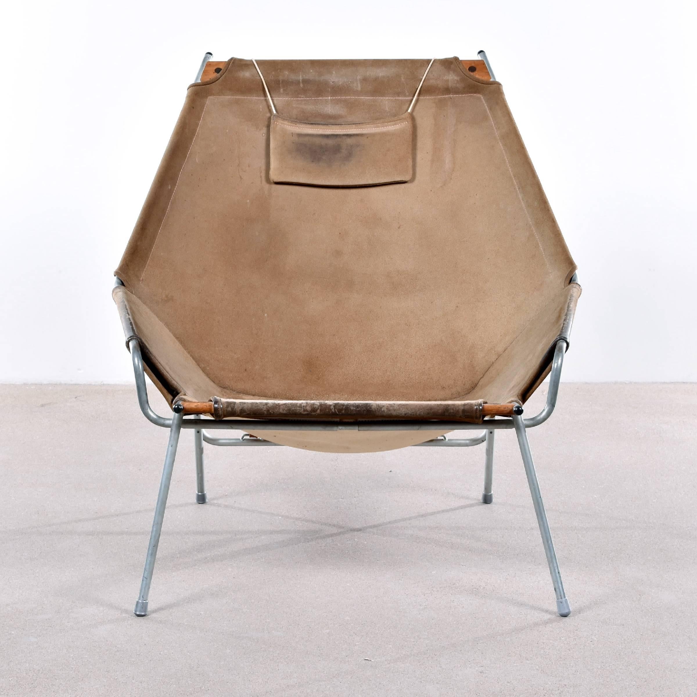 Very rare, collectable and elegant lounge chair by Erik Ole Jørgensen for Bovirke. Very good original condition with beautiful patina. Tubular steel frame with suede leather upholstery and leather straps. Hard to find chair!