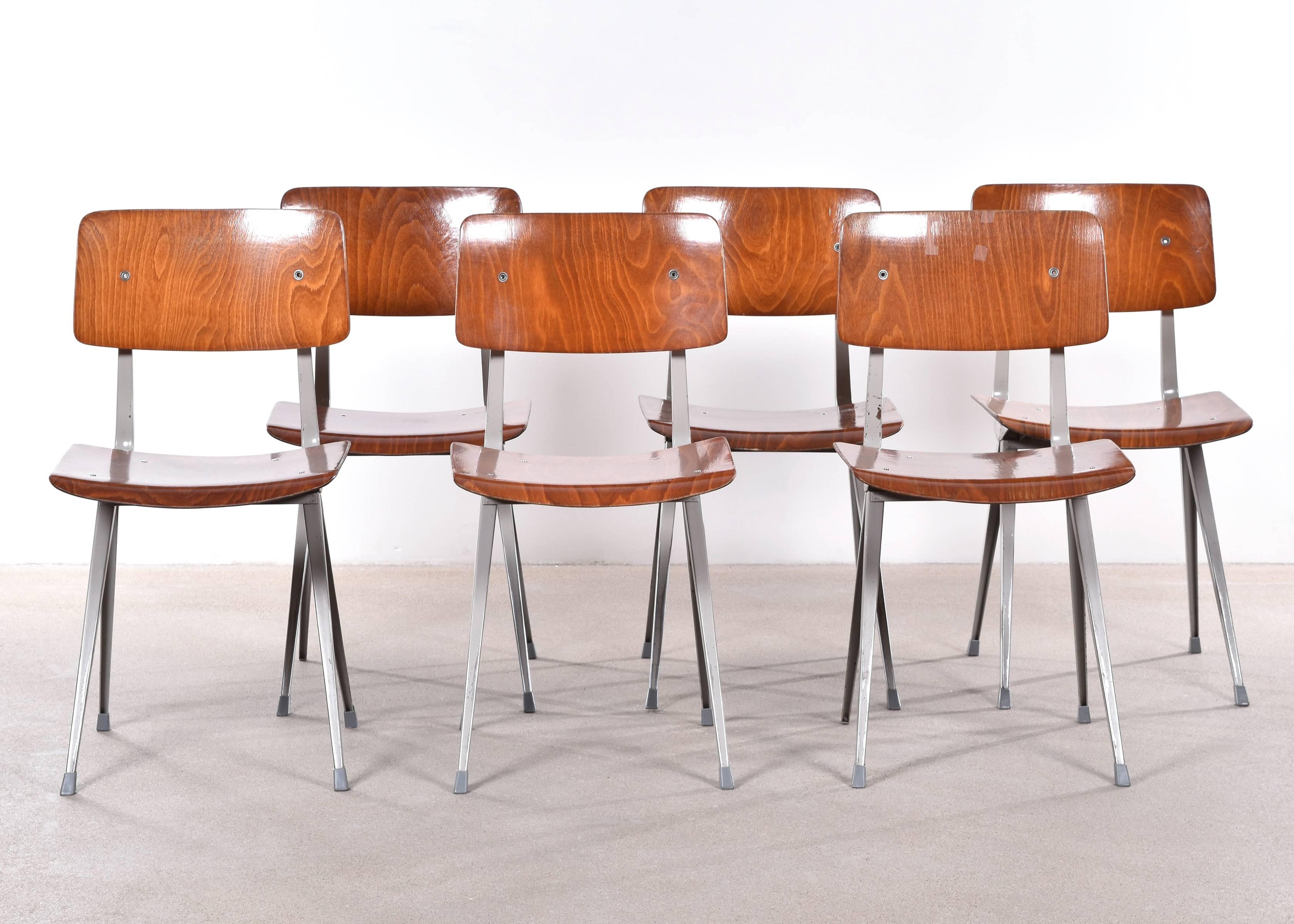 Functional, Industrial and comfortable Friso Kramer result (second edition) plywood chairs. Plywood (synthetic) seats or backs in good condition. Slight rust and scratches on frames. Signed with impressed manufacturer's mark and labels.