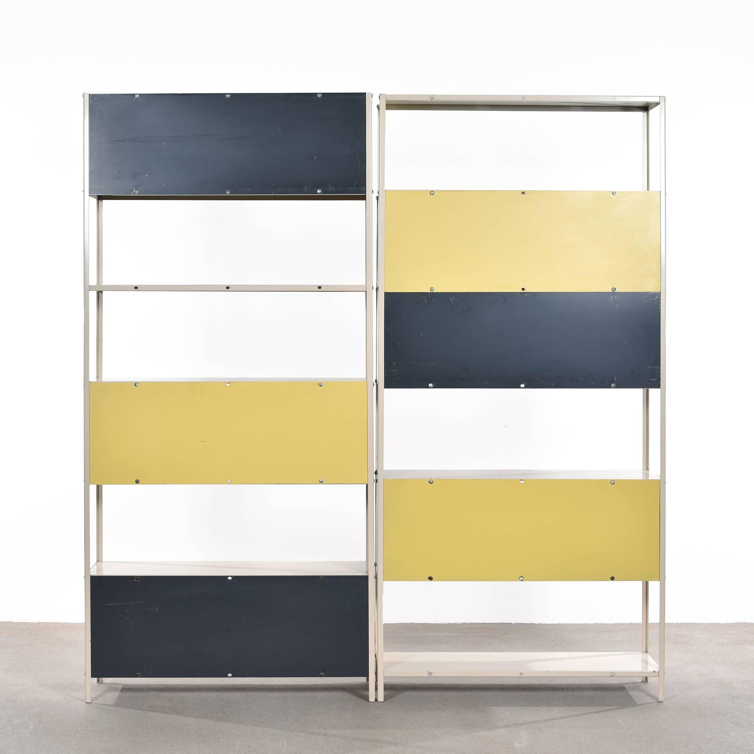 Rare modular bookcase/room divider designed by Friso Kramer in 1953 for 'De Bijenkorf' and produced by Asmeta. The two units can easily be combined to one if desired. Minimalistic industrial Dutch design in good original condition.

Free shipping