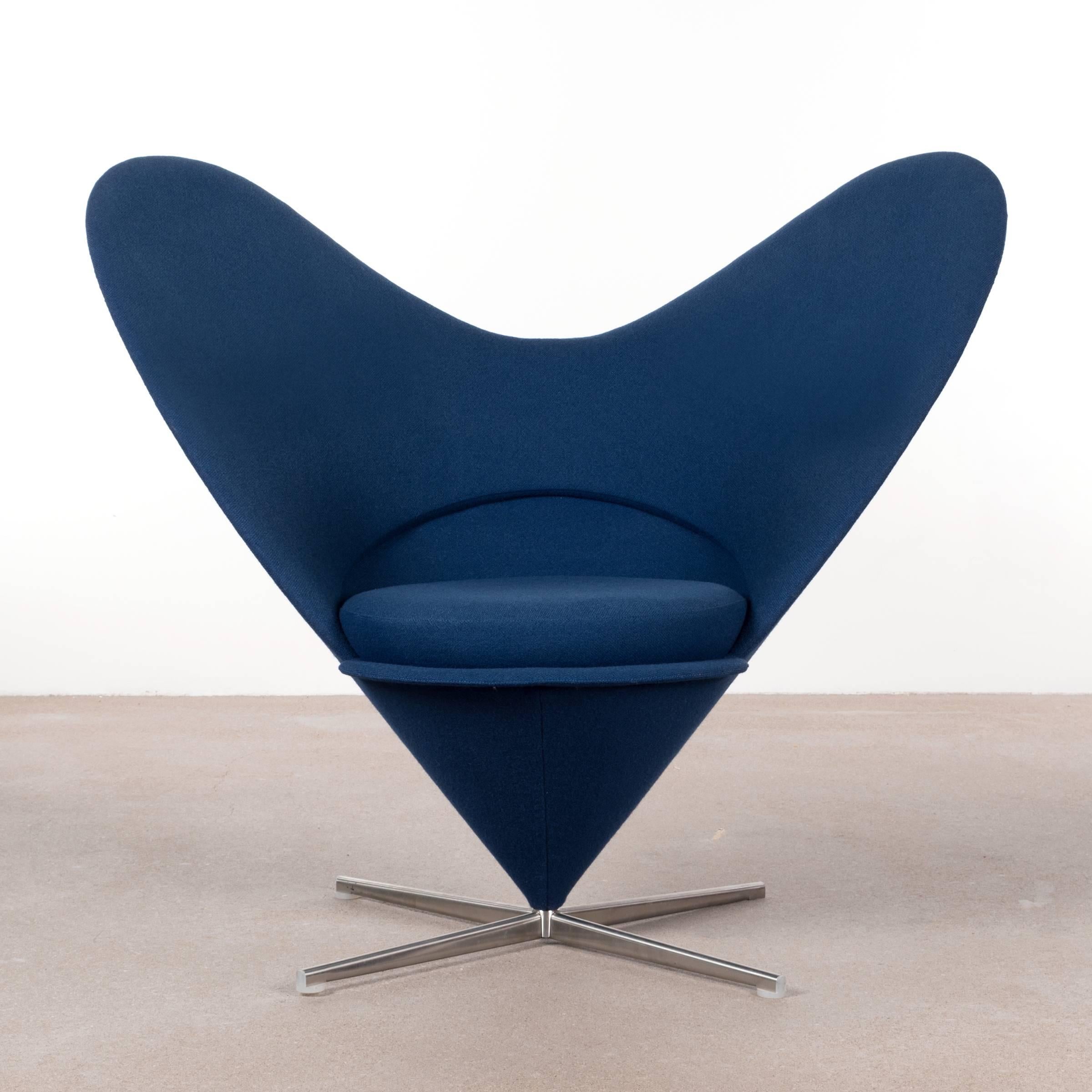 Elegant and beautiful cone heart chair by Verner Panton. Very good original condition with swivel base and Kvadrat dark blue wool upholstery. Signed with manufacture label.