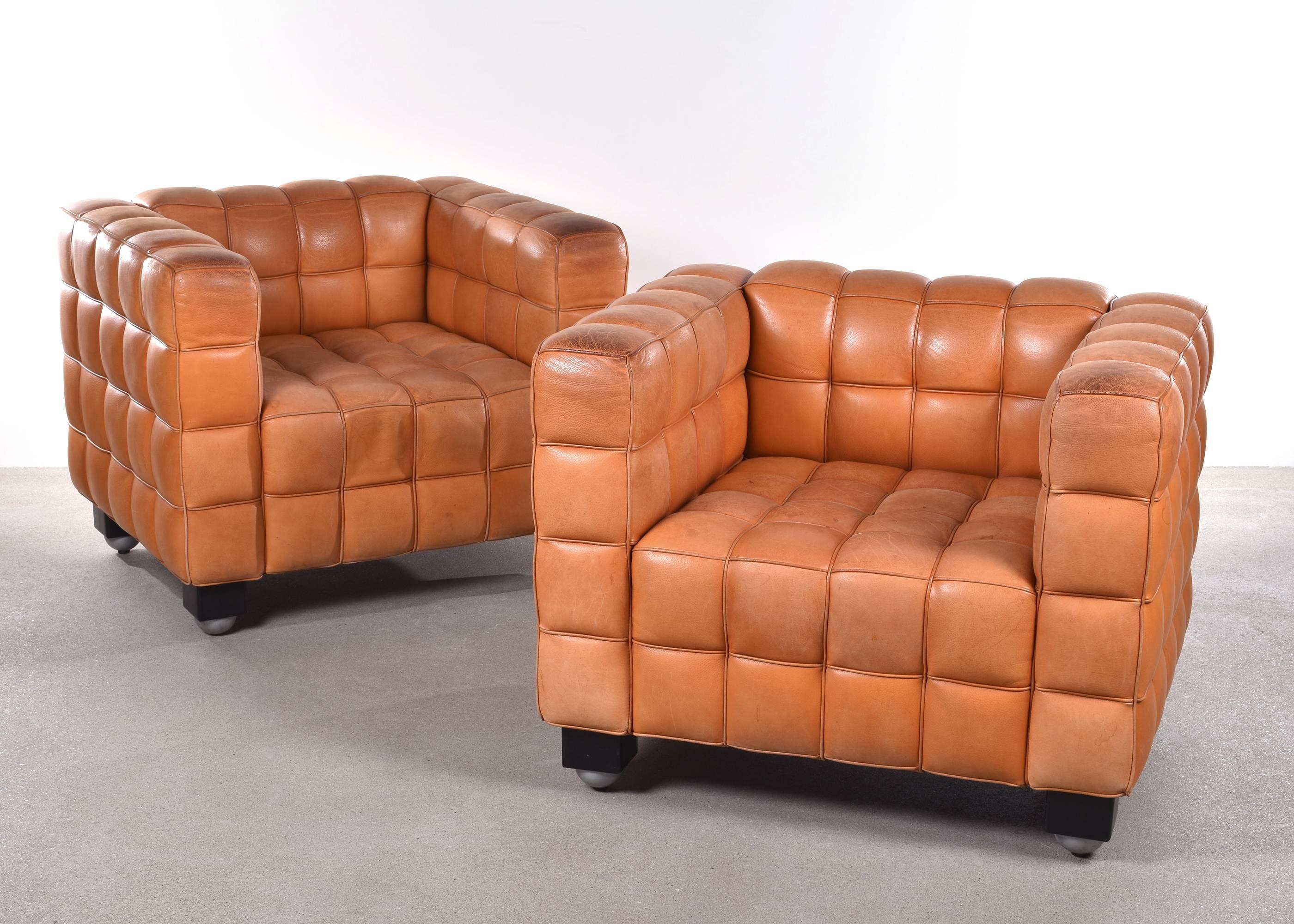 Great geometric armchairs from Josef Hoffmann, designed in 1910. Cognac leather with lot's of life and patina. Brown patinated leather. Both chairs are signed with manufacturer's label.

Free shipping for European destinations!

We strive for a