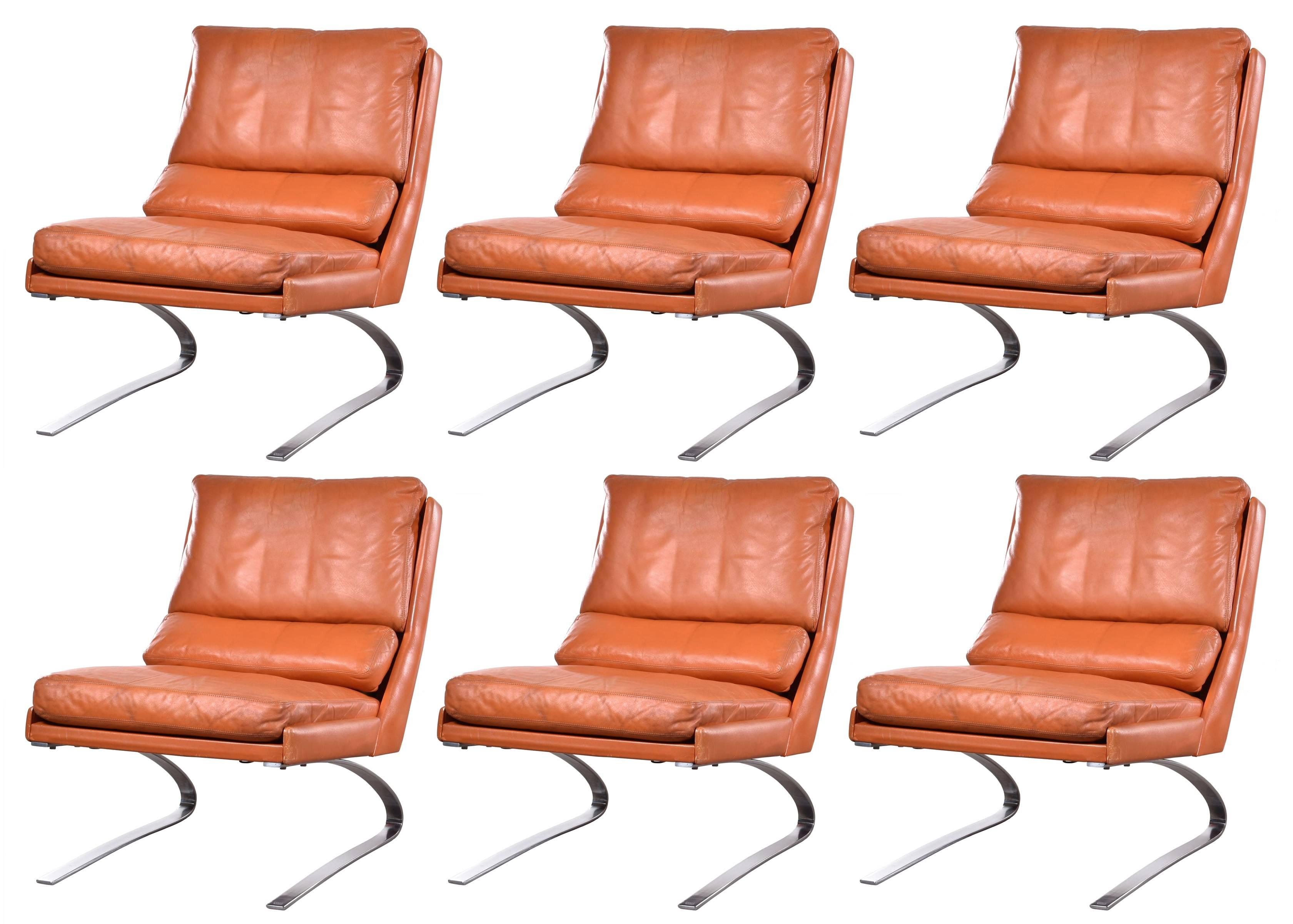 Extremely comfortable lounge chairs due 'spring' frame and down filled leather cushions. The original orange or cognac leather is in good condition with light traces of use and nice patina. Six chairs are available.
Feel free to contact us if you