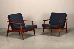 Pair Scandinavian Modern armchairs in teak and dark blue bouclé fabric, 1960s