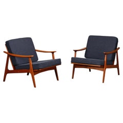 Pair Scandinavian Modern armchairs in teak and dark blue bouclé fabric, 1960s