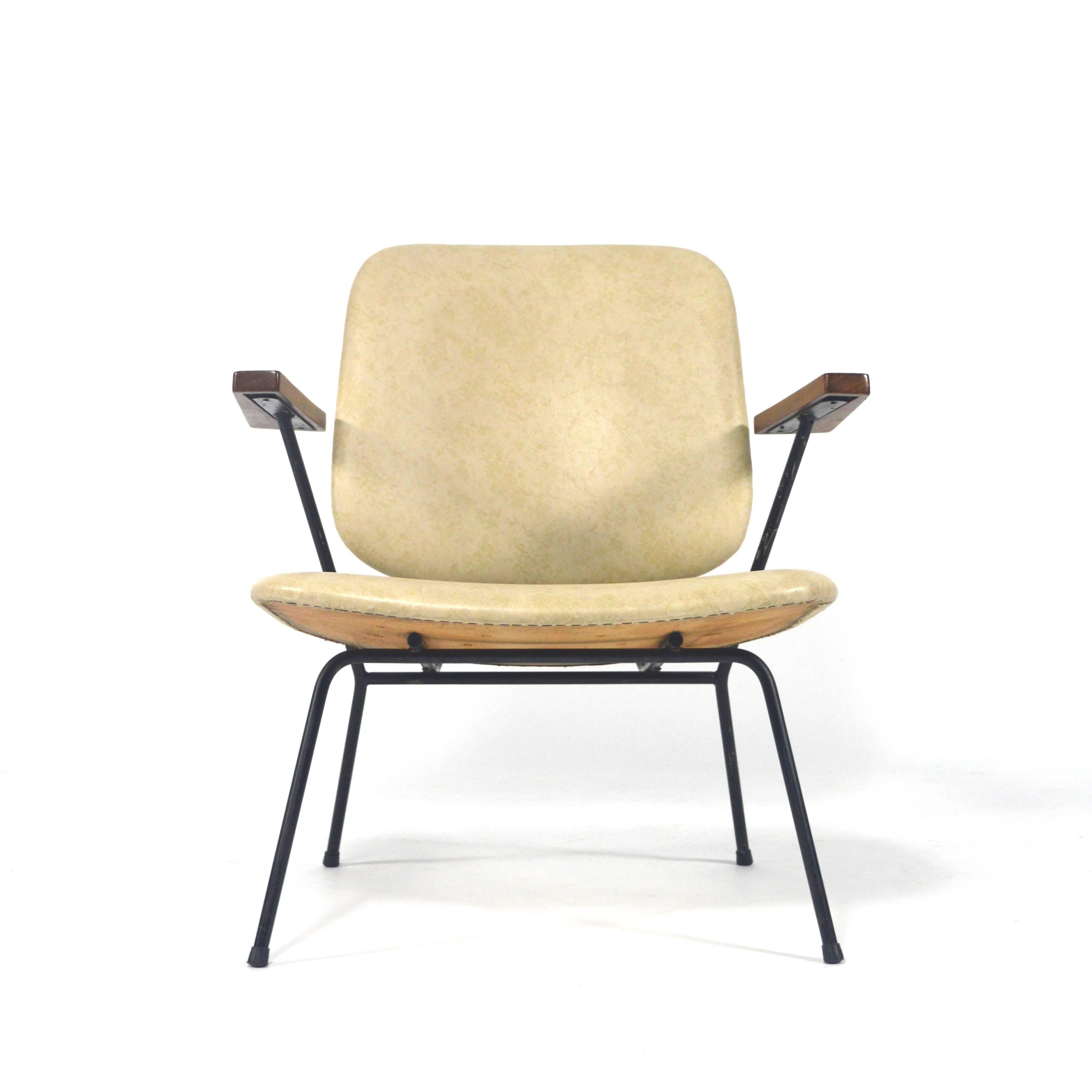 Rare model easy chair by Willem Hendrik Gispen for Kembo.
Original Faux leather upholstery with solid Teak armrests and a black lacquered metal base.