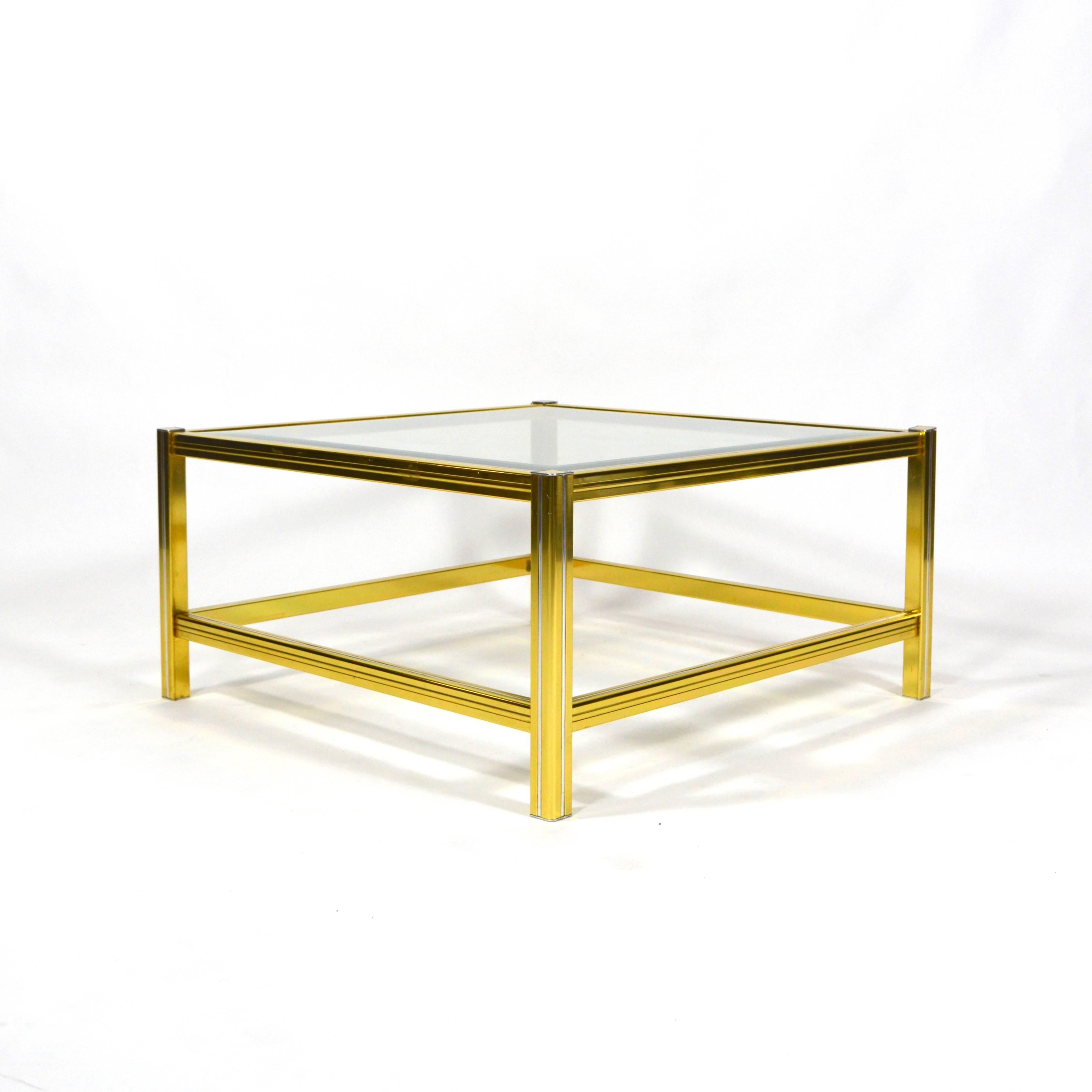 Beautiful Italian coffee table.
It is made of brass with chrome details and has a glass top with cut edges.
In good condition with normal age related signs of use.
 