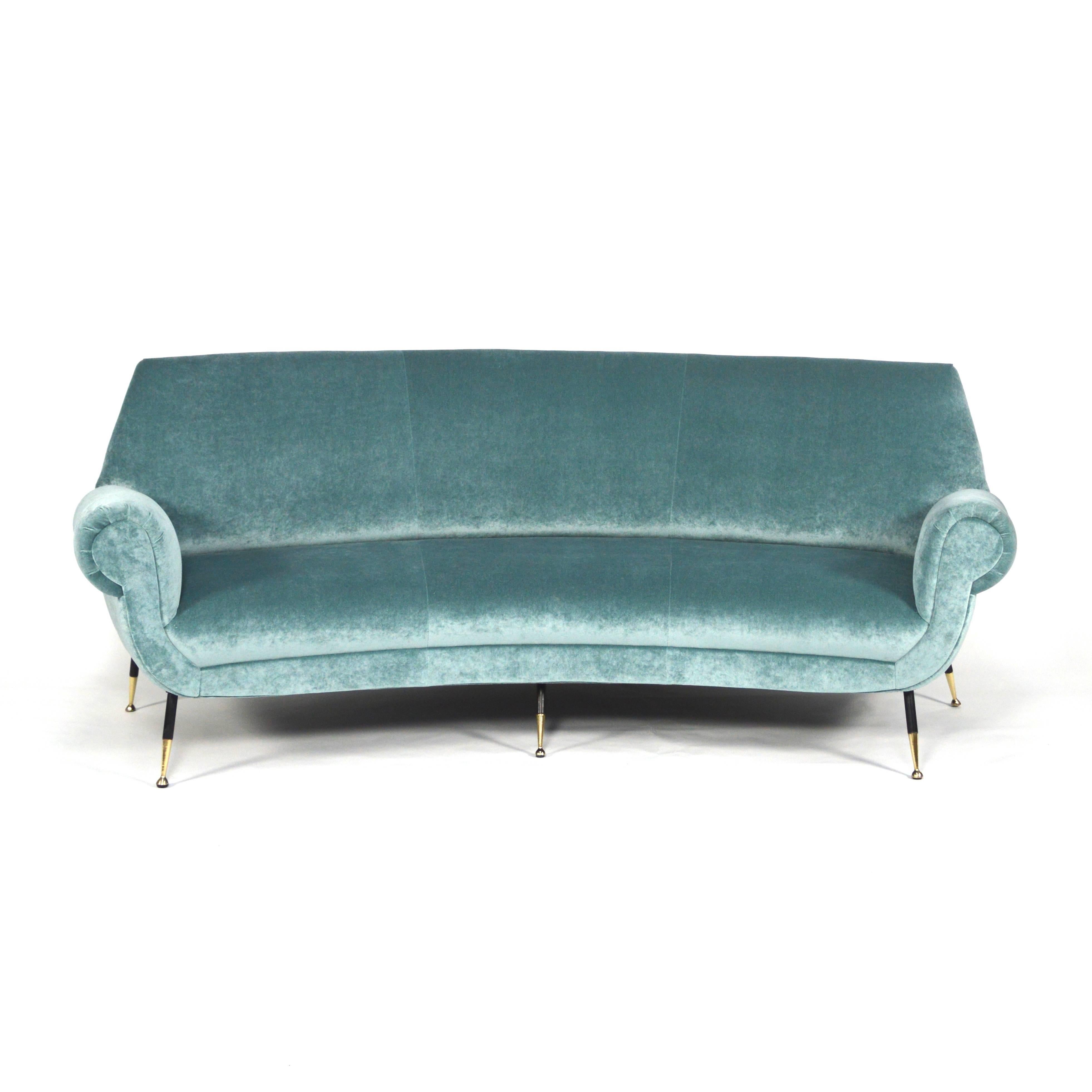 Gorgeous rare curved sofa by Gigi Radice for Minotti, Italy. The sofa is completely refurbished with new foam interior and re-upholstered in a beautiful aqua blue/green velvet by JAB ‘Urban Velvets’.

Upholstered by one of the best Dutch craftsman