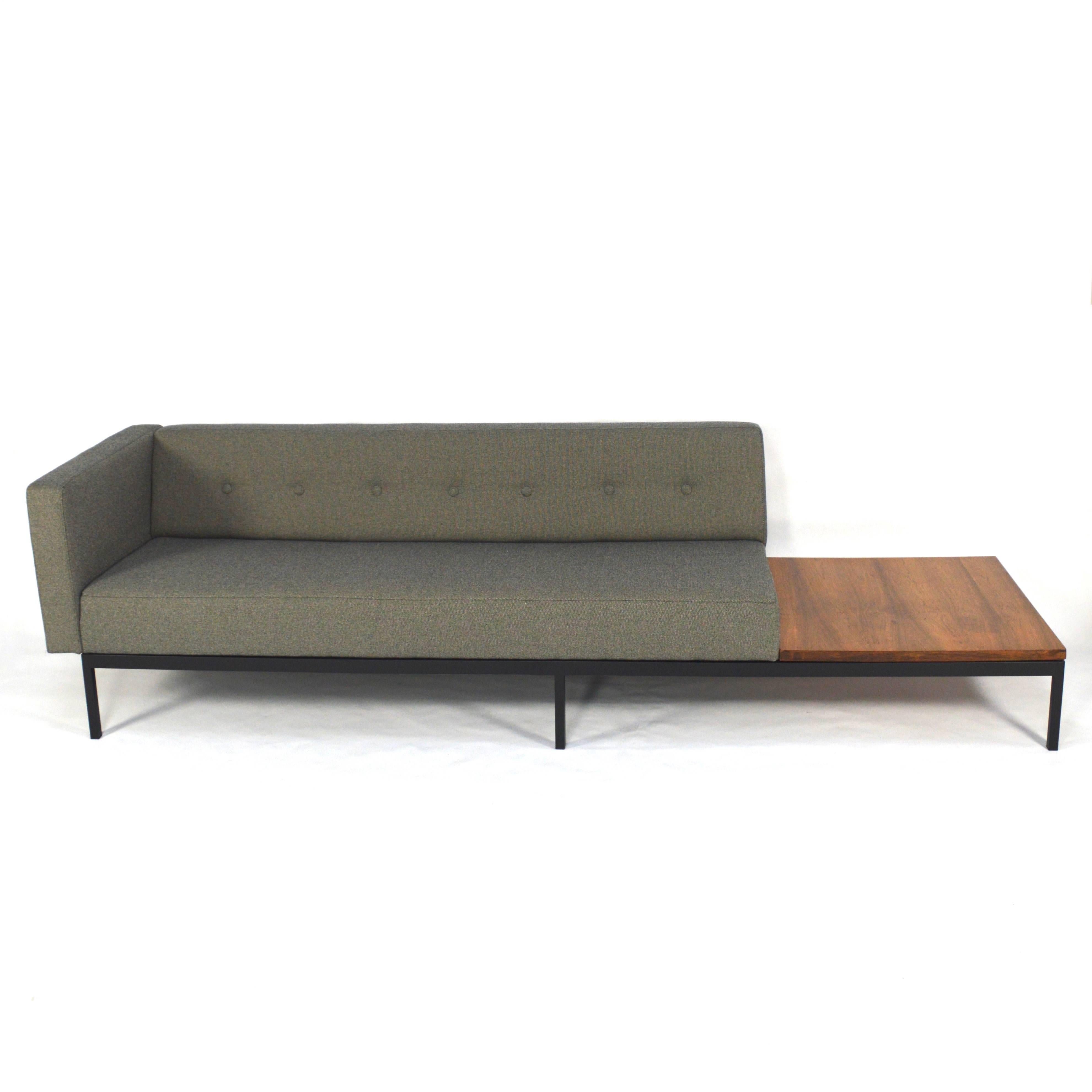 Gorgeous and timeless sofa with rosewood coffee table designed by the renowned designer Kho Liang Ie.
Completely reupholstered with new foam filling and fabric. 
The black lacquered metal base has also been restored.
The rosewood coffee table has