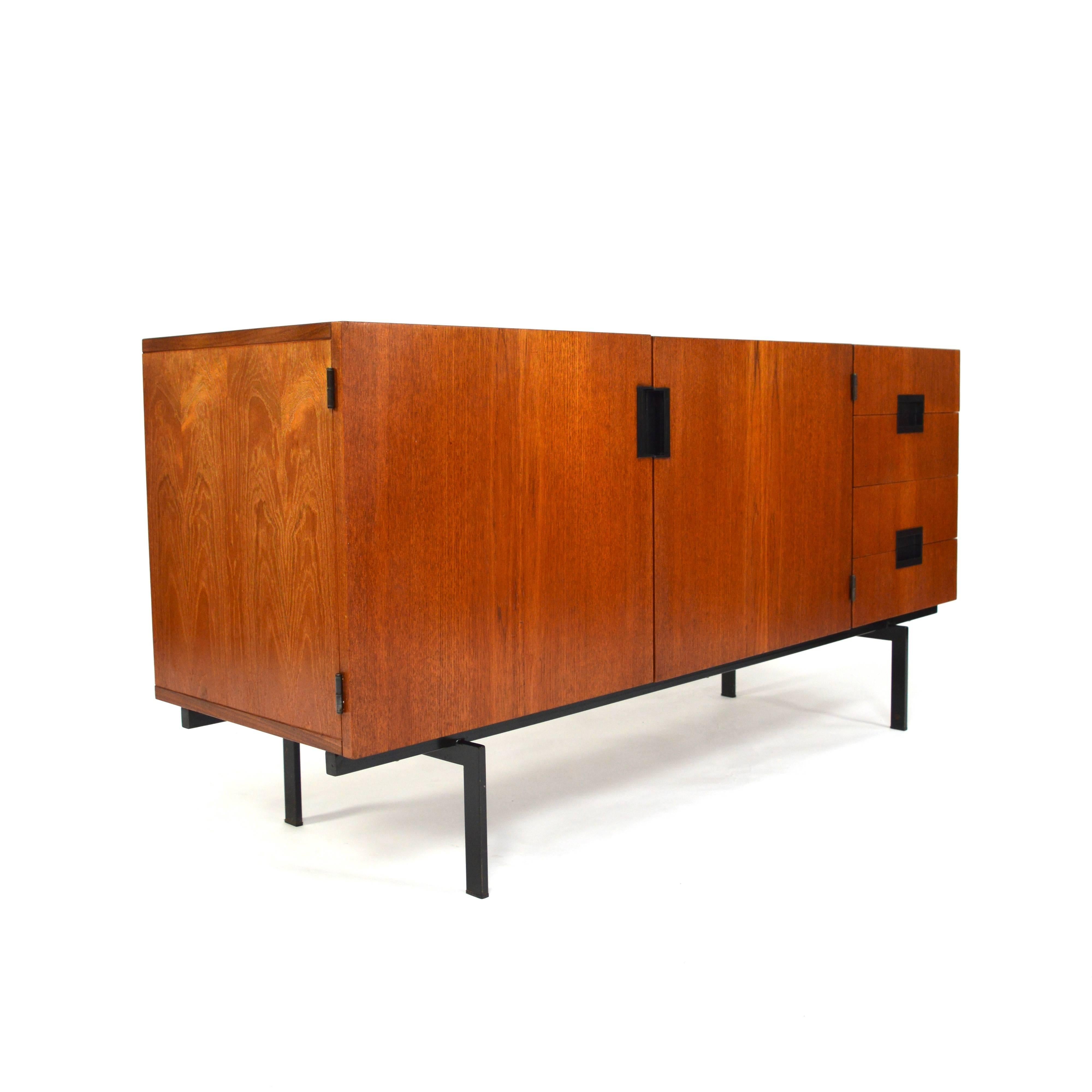 Rare size DU-01 Japanese series sideboard by Cees Braakman.
Teak with black lacquered metal base.
The inside of the drawers is beautifully made of bent plywood.
In excellent condition. Small restoration on top of the left door.
  