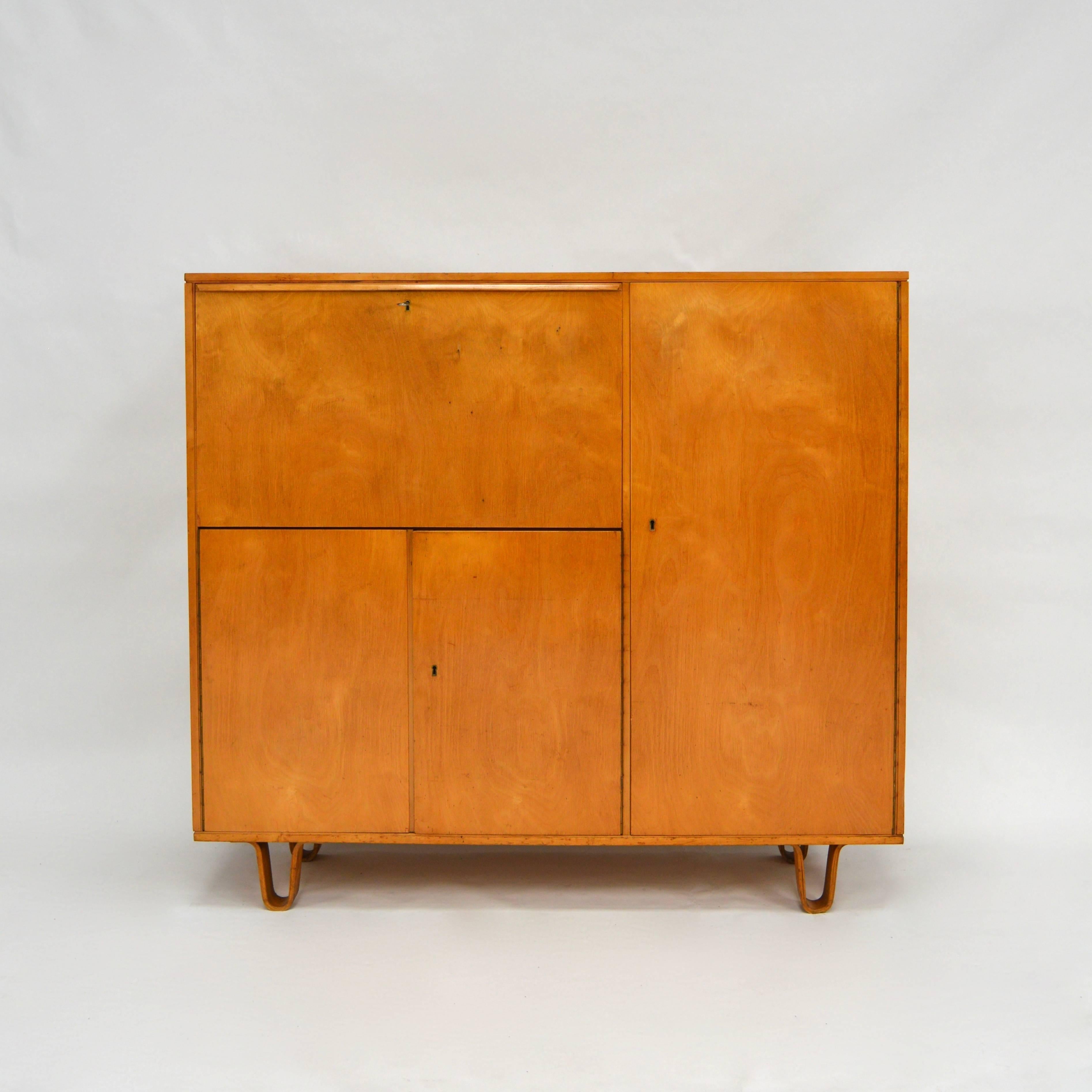 Model CB01 birch series cabinet by Cees Braakman for Pastoe. The cabinet has some age and use related wear and small damages but overall in good condition. It has a drop down door that can be used as writing desk. It also has the famous plywood