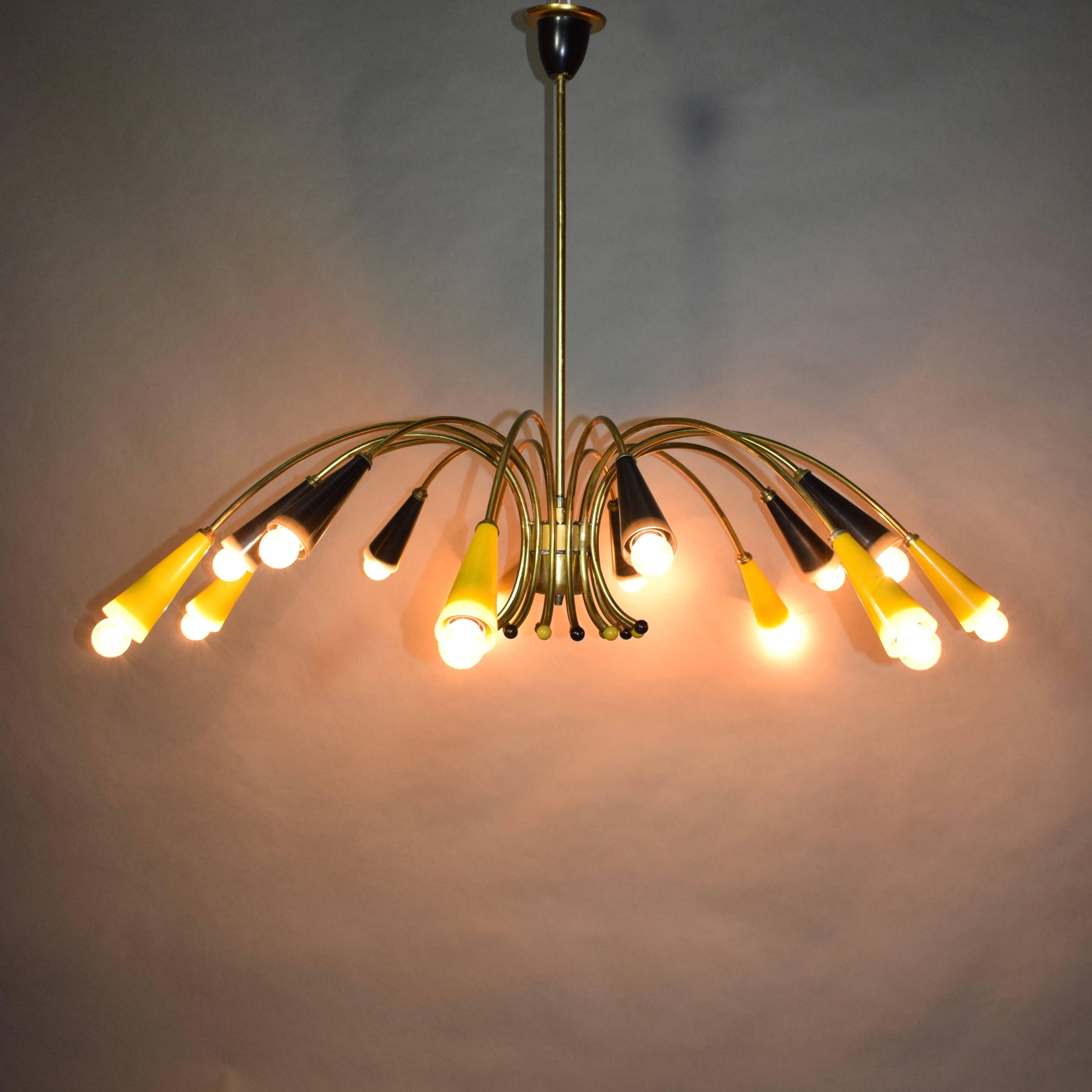 Very large brass spider chandelier from the 1950s. The shades are made of yellow and black glass. These lamps come from an East-German café.


Designer: Unknown

Manufacturer: Unknown

Country: Germany

Model: Chandelier / pendant lamp

Designed in: