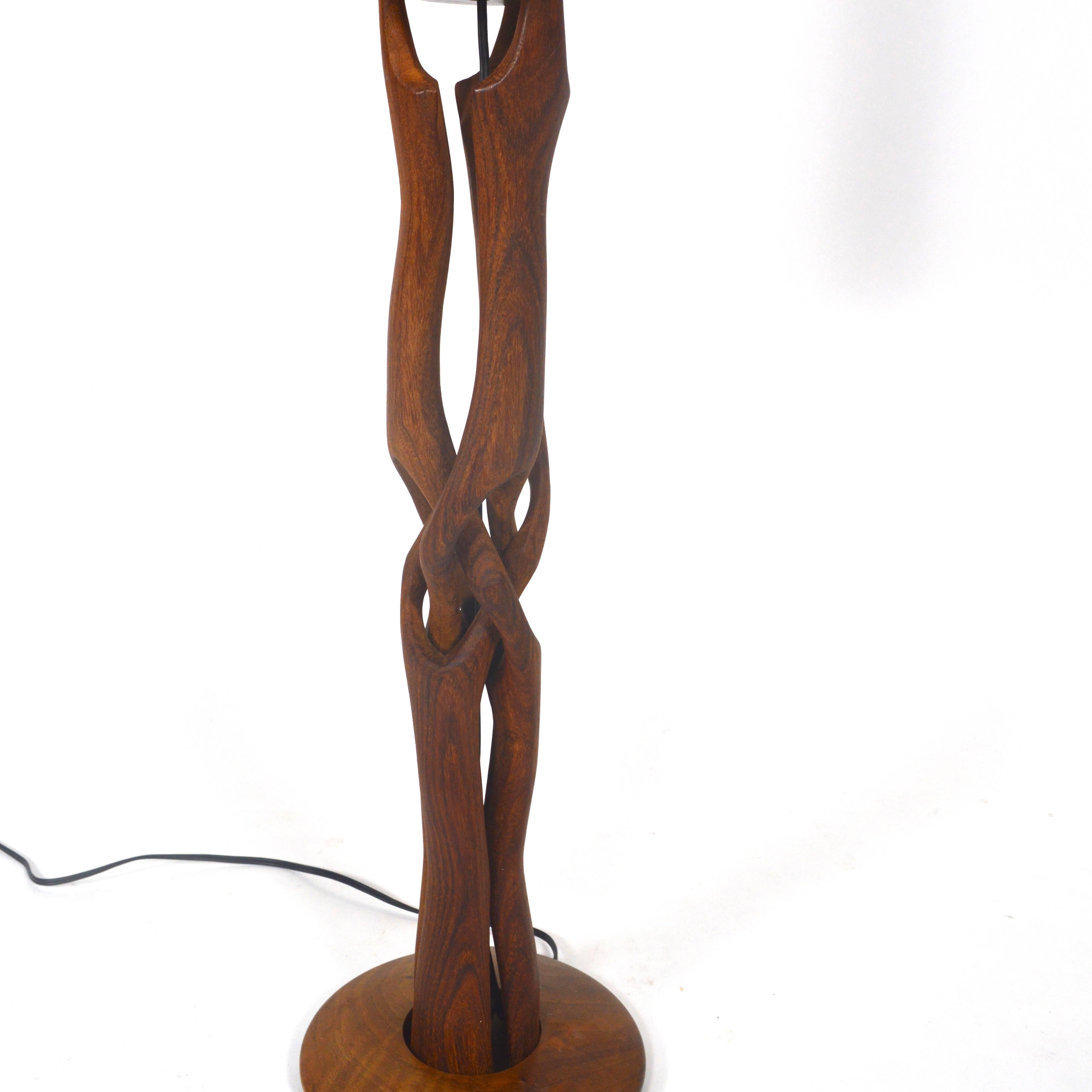 Very rare one-of Scandinavian design table lamp. The wood is hand-carved from one piece of solid Teak. It's organic shapes are made to look like tree roots.
This lamp is a true work of art. An eye catcher that will make people talk about.
In
