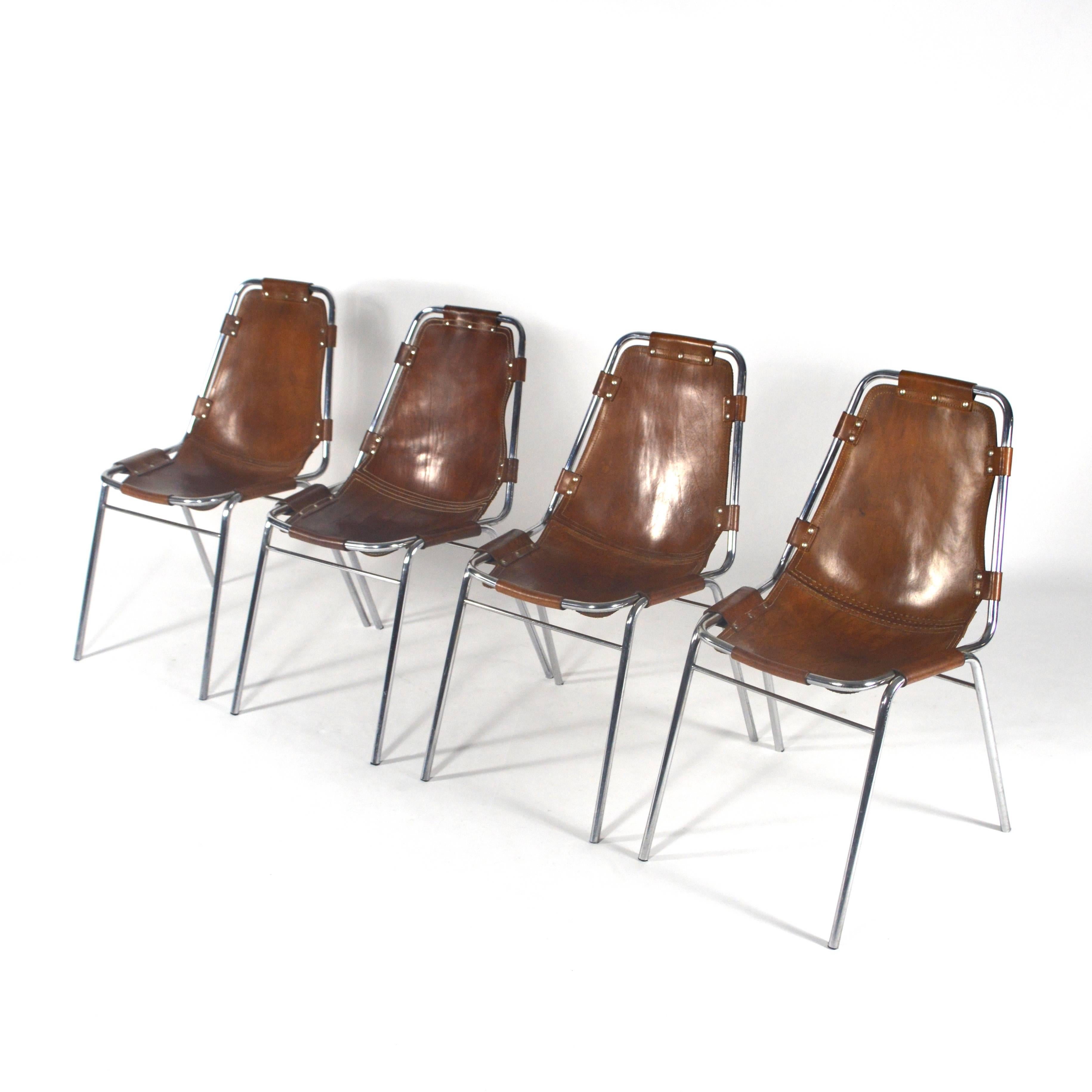 4 Charlotte Perriand Les Arc chairs.
In very good condition. One chair has restored stitching (if wanted we can have this done for all chairs). 
Nice patina to the leather.
Normal age related wear (no holes or tears in the leather).