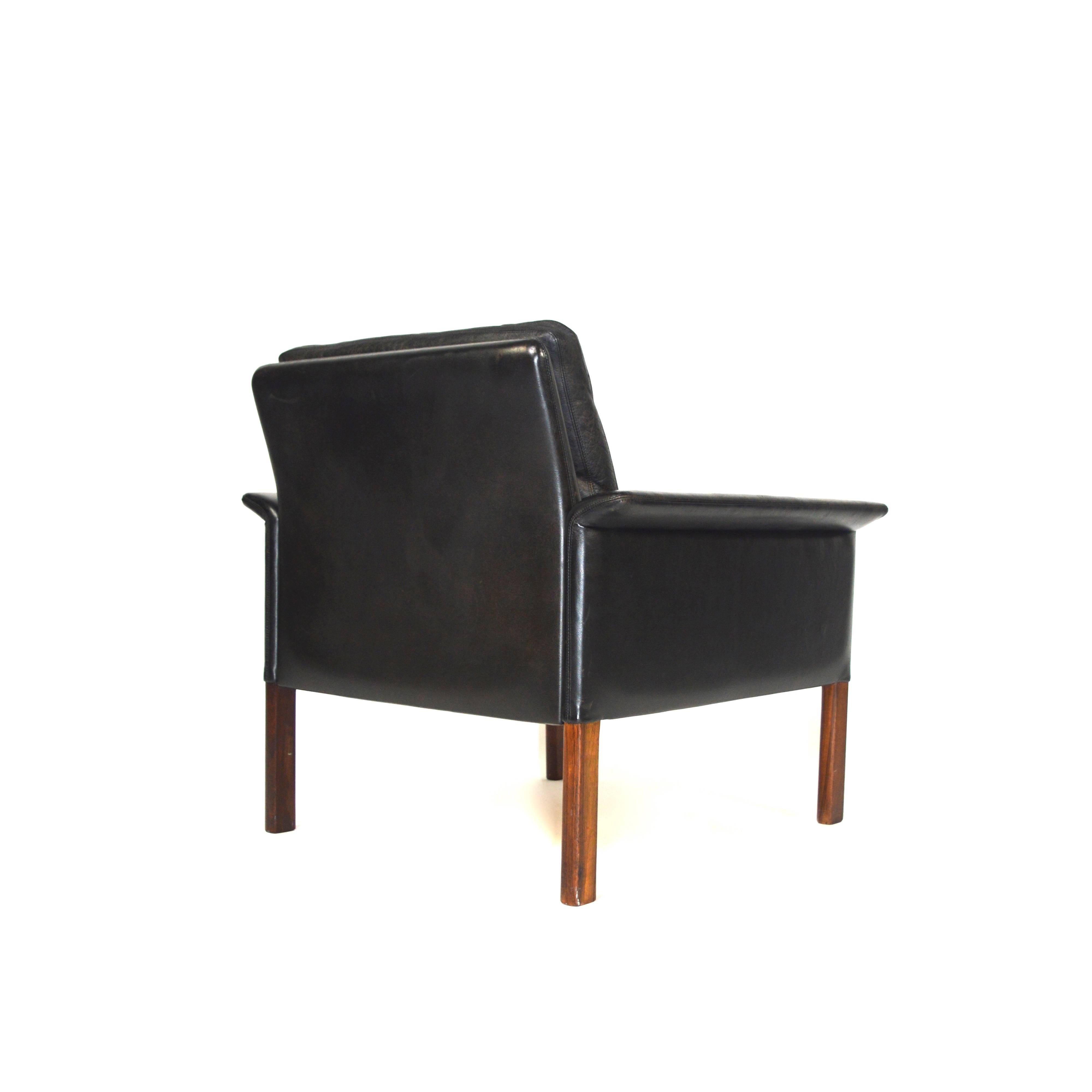Beautiful easy chair designed by Hans Olsen for CS Møbelfabrik in Denmark. This chair was designed in 1963 and is made of black leather with solid Rosewood feet. 
This chair is in very good condition with nice patinated leather. Minor age related