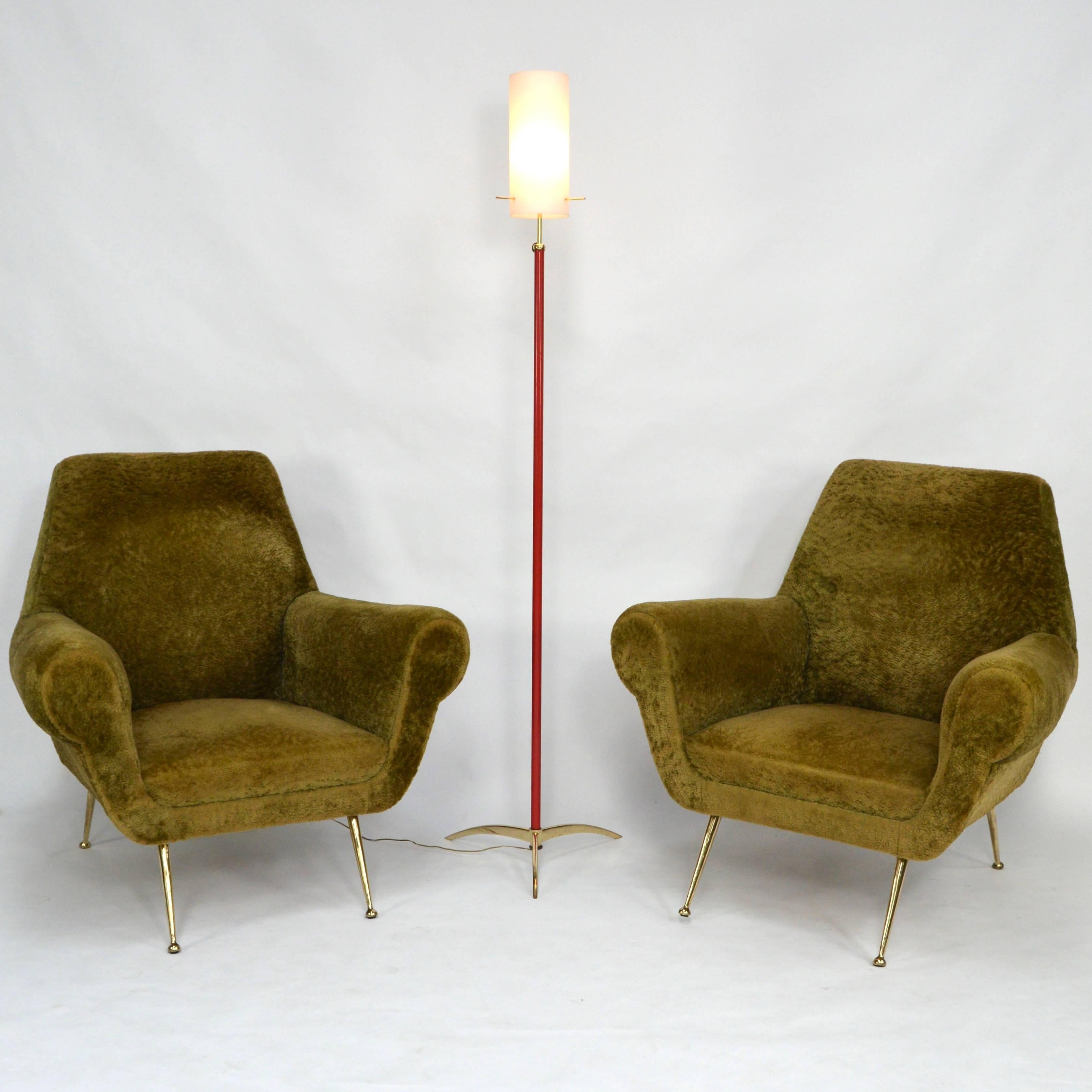 Stunning Italian floor lamp with opaline glass lamp shade and brass details. 
Maybe manufactured by Arredoluce.
The lamp shade is adjustable in height. 
Very elegant and exclusive model in excellent condition. 
The brass has been polished to