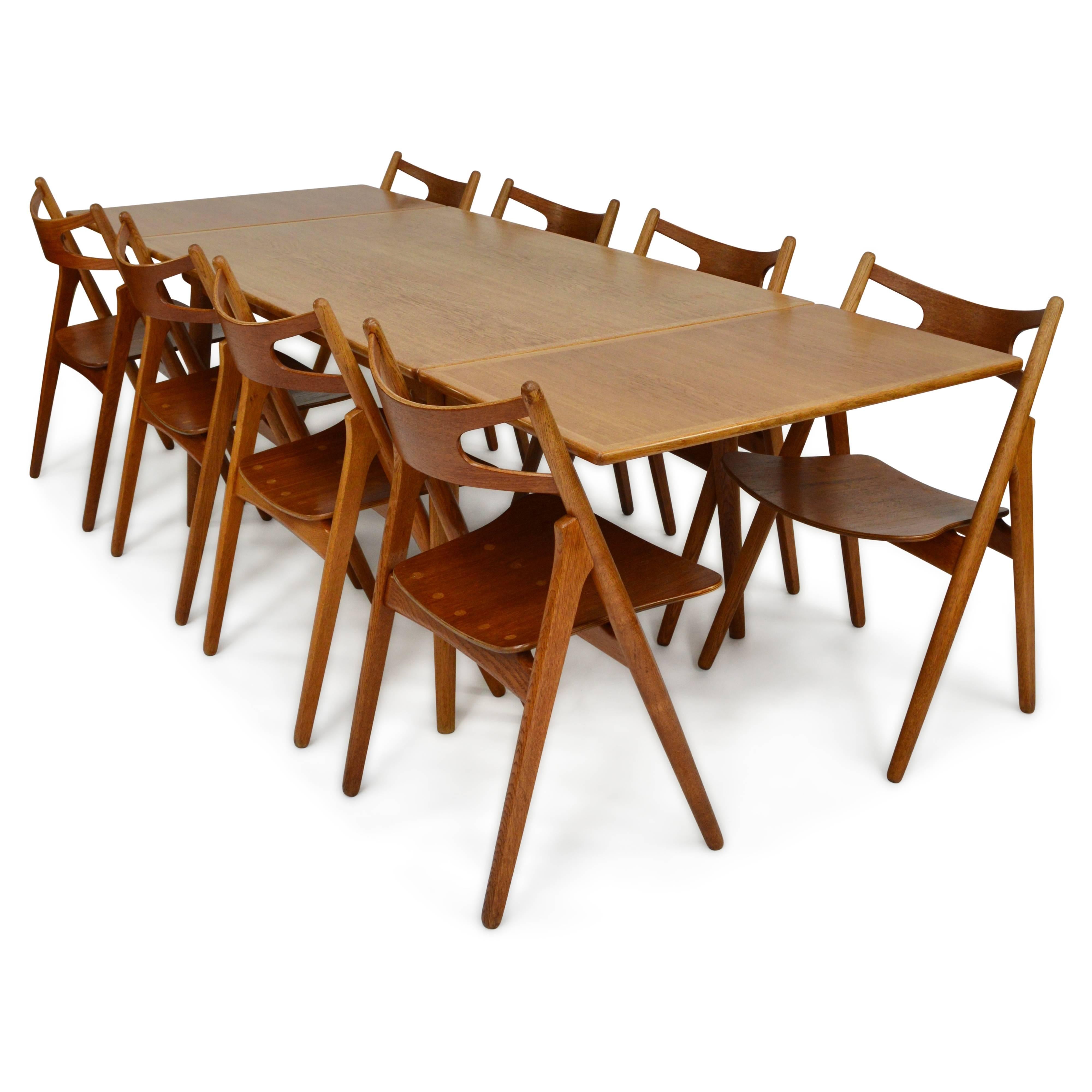 Rare AT-312 dining table and CH29 Sawbuck dining chairs by Hans J. Wegner. The table and chairs have been completely refinished with a multilayer hardwax oil, back to it’s original look. They are made of Oak and Teak.
In excellent restored
