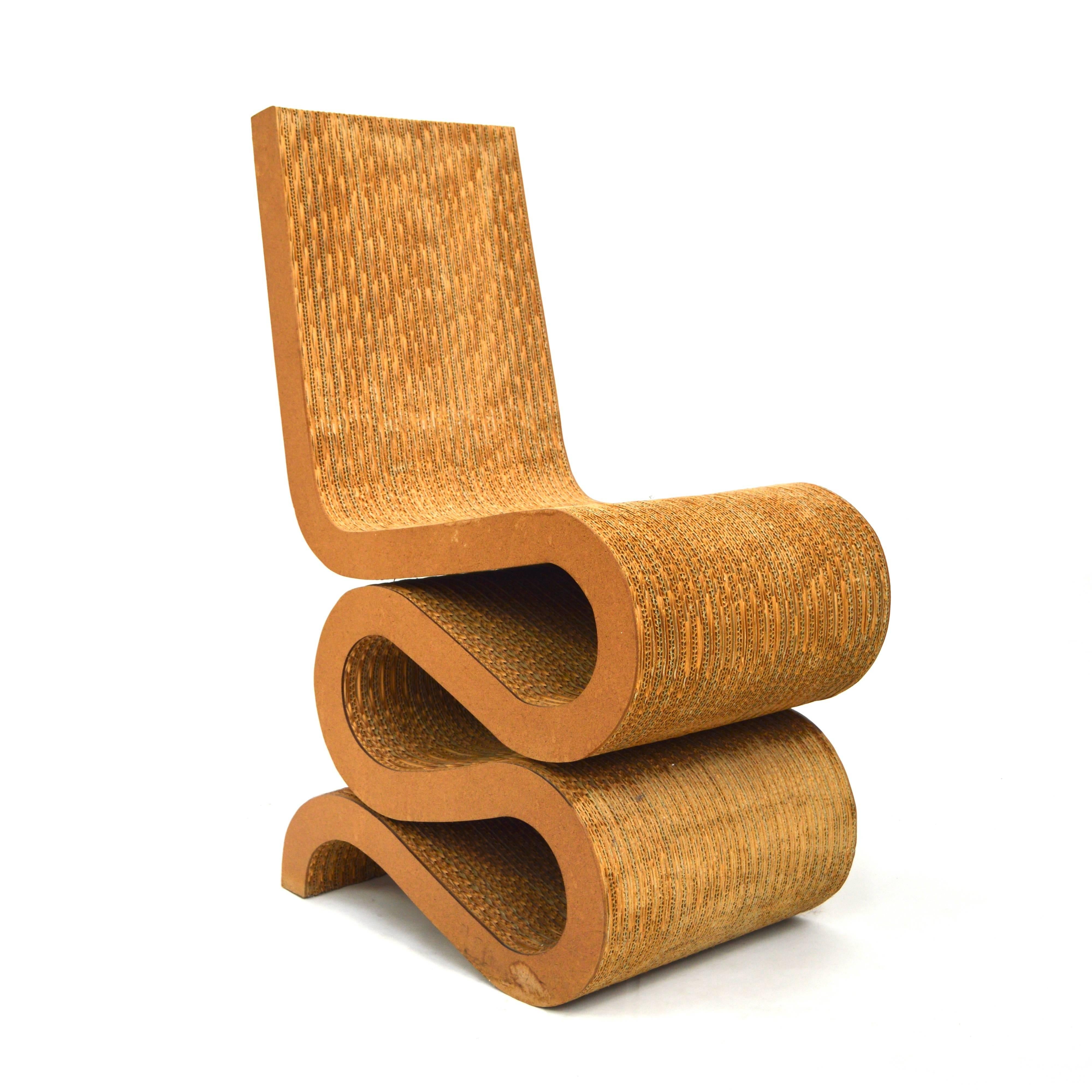Wiggle chair by Frank Gehry (USA, b. 1929).
Designer: Frank O. Gehry

Manufacturer: VITRA

Date of design: 1972

Date of manufacture: 1990s

Model: Wiggle chair

Material: Cardboard / Hardboard

Size wdh in cm: 36 x 59 x 86 seat height
